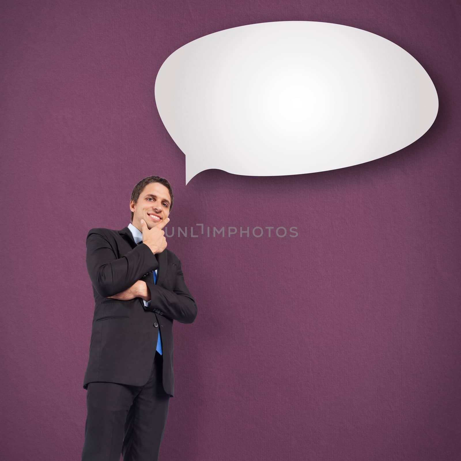 Thinking businessman touching chin against speech bubble