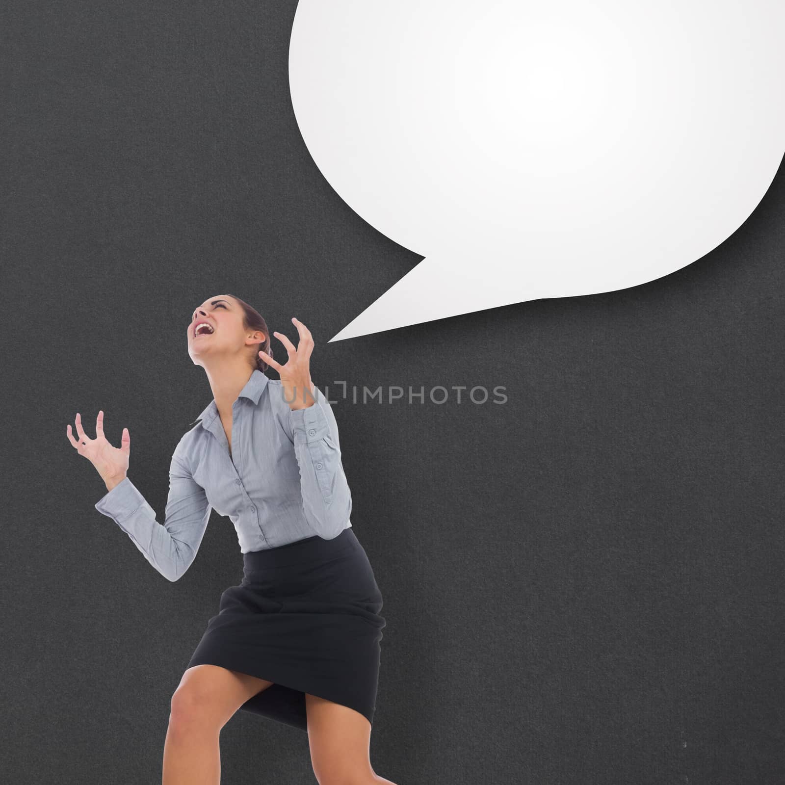 Furious businesswoman gesturing against speech bubble