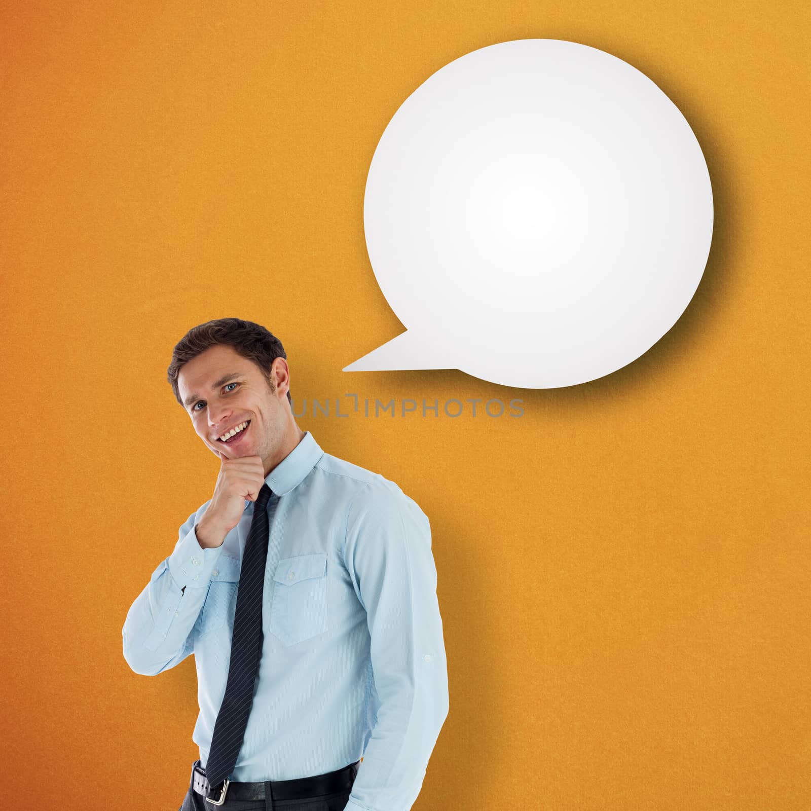 Thoughtful businessman with hand on chin against speech bubble