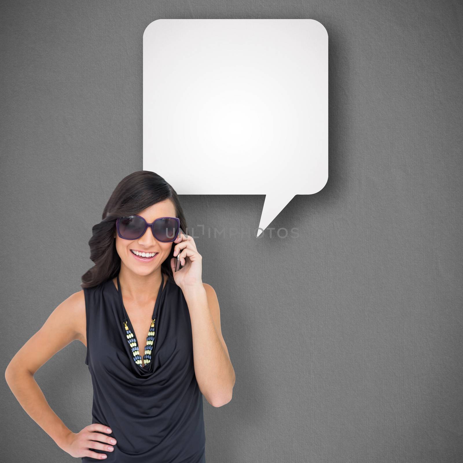 Composite image of happy brunette phoning by Wavebreakmedia