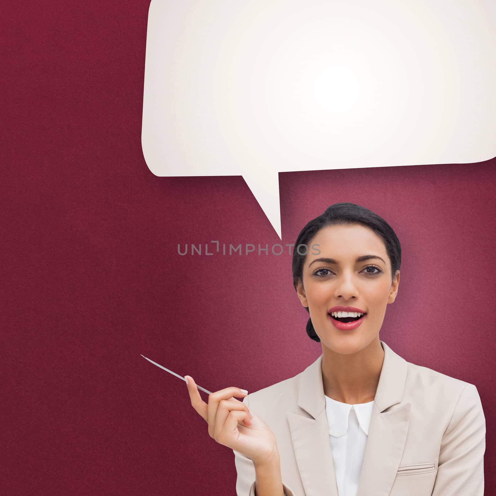 Composite image of smiling businesswoman holding a pen by Wavebreakmedia