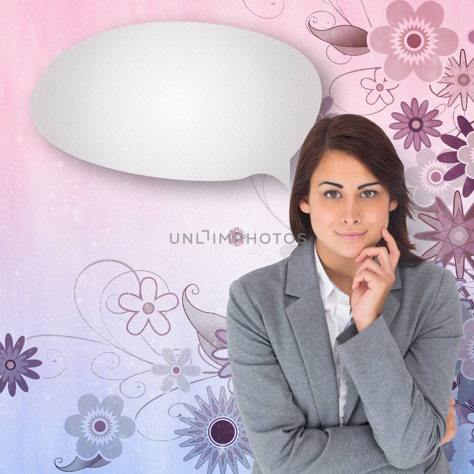 Smiling thoughtful businesswoman with speech bubble against digitally generated girly floral design