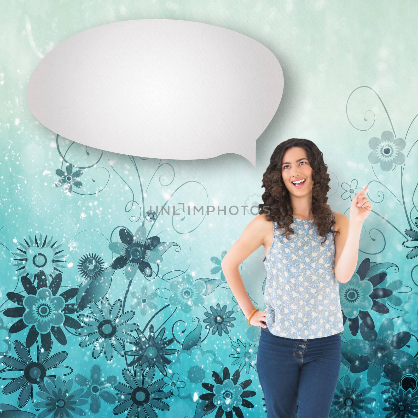 Composite image of happy beautiful brunette posing with speech bubble by Wavebreakmedia