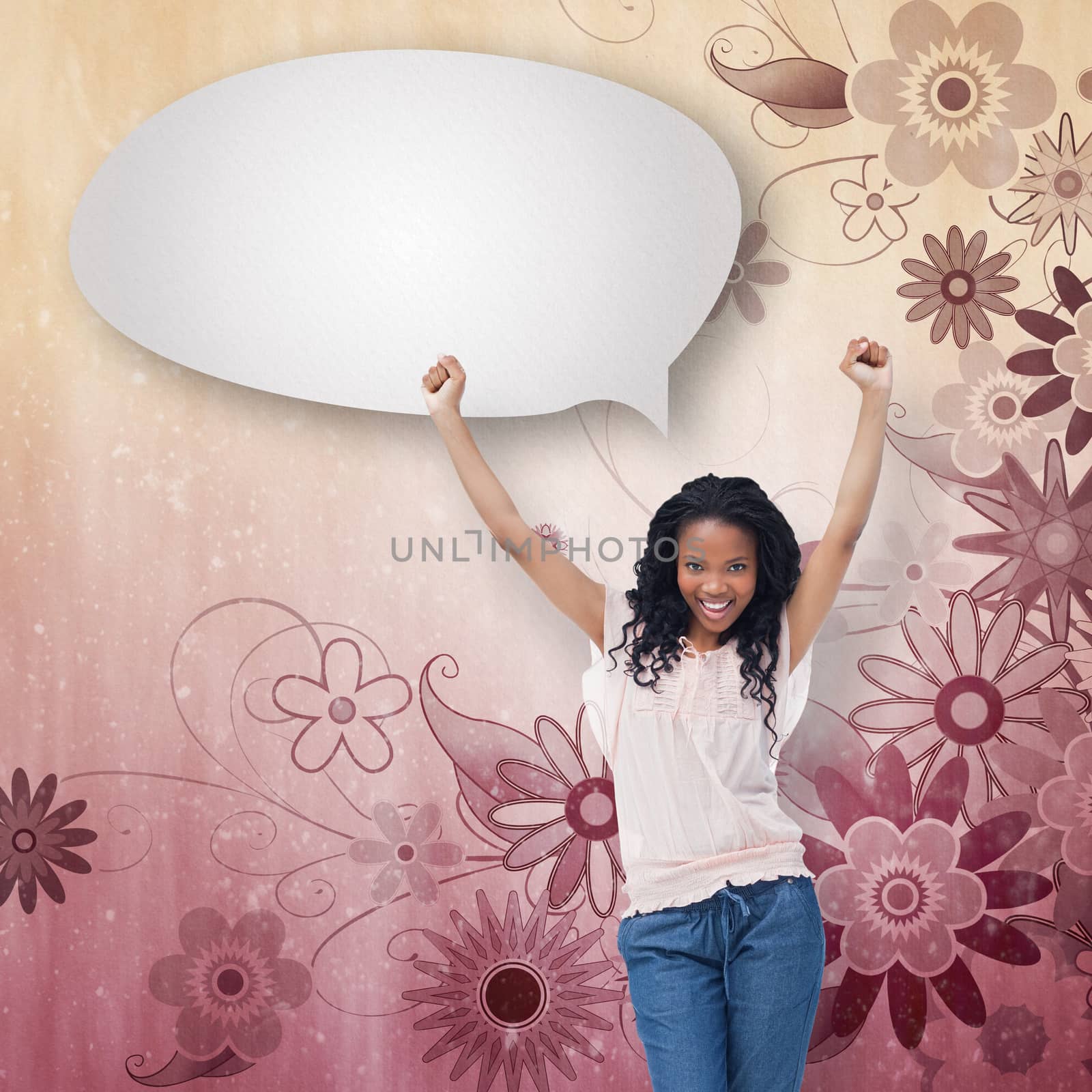 A young happy woman stands with speech bubble against digitally generated girly floral design