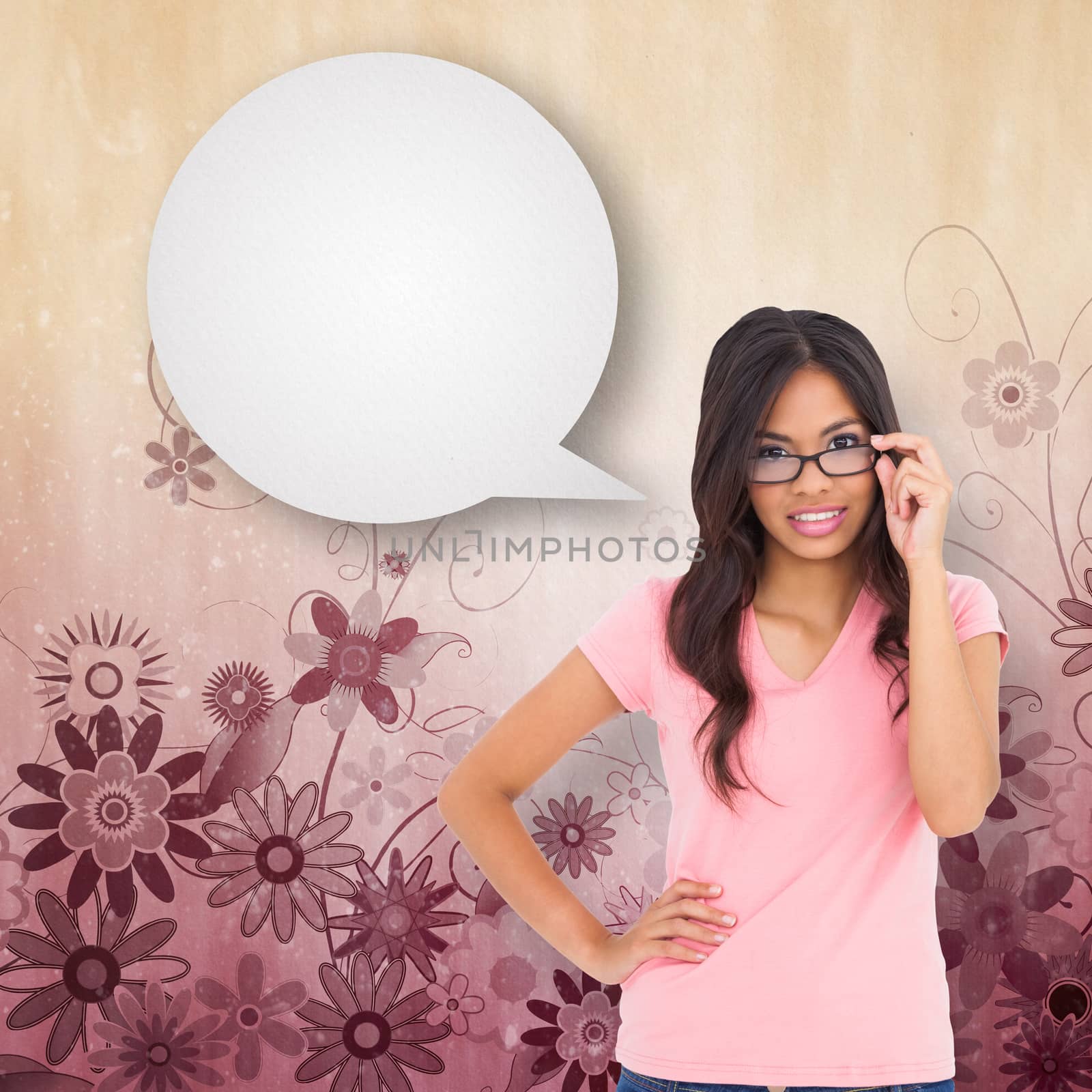 Pretty brunette thinking with speech bubble against digitally generated girly floral design