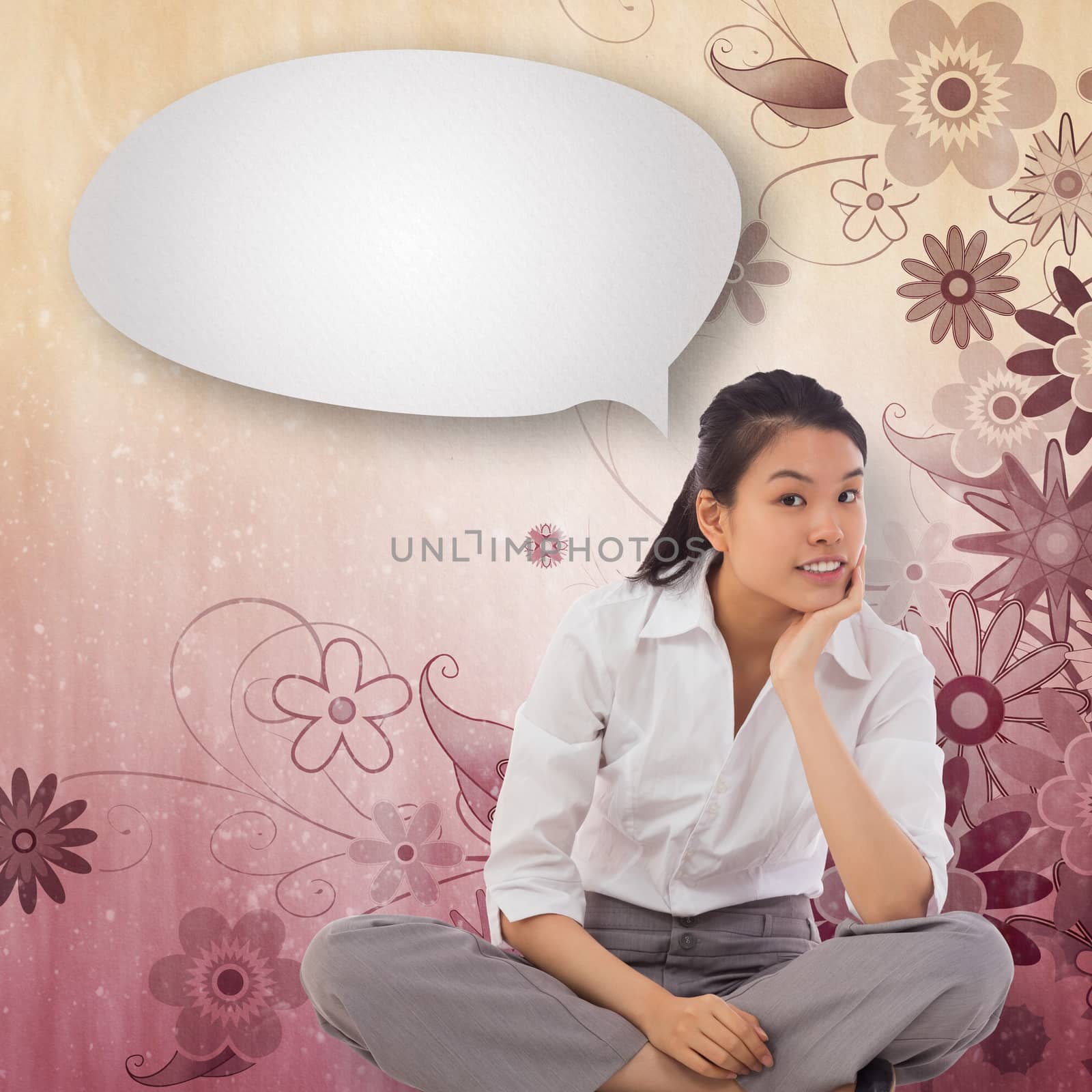 Composite image of businesswoman sitting cross legged thinking with speech bubble by Wavebreakmedia