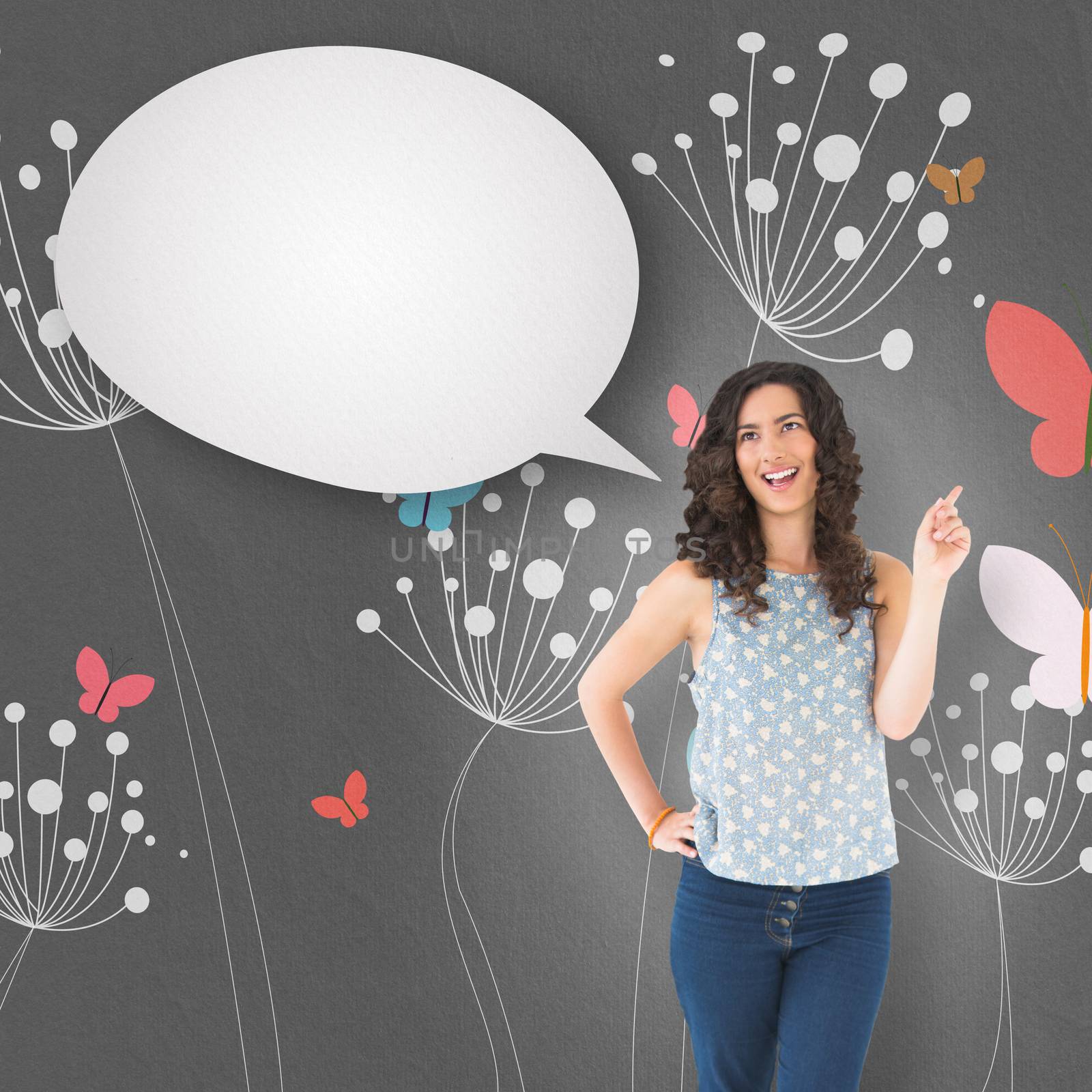 Composite image of happy beautiful brunette posing with speech bubble by Wavebreakmedia