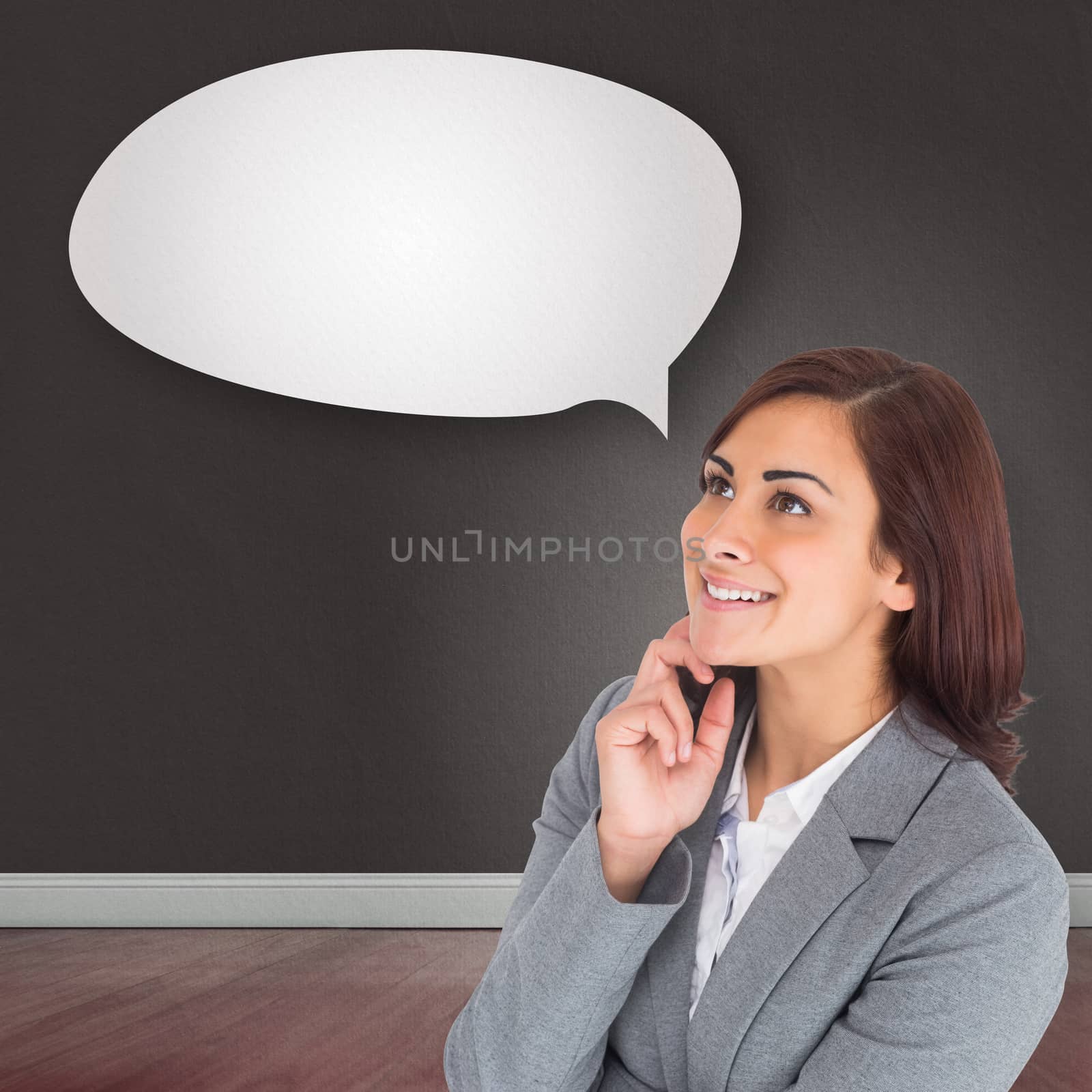 Smiling thoughtful businesswoman against speech bubble