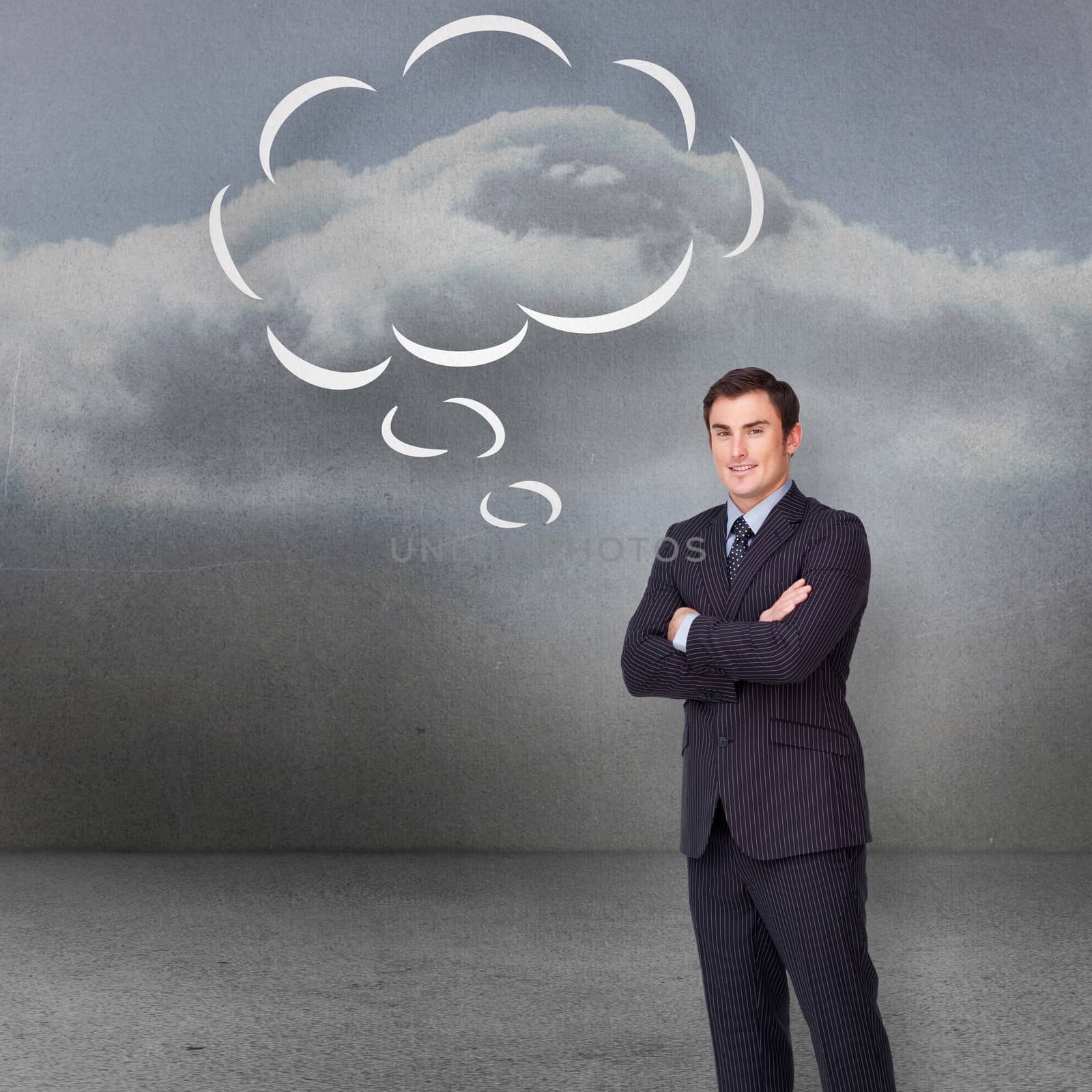 Composite image of young businessman standing cross-armed with speech bubble by Wavebreakmedia