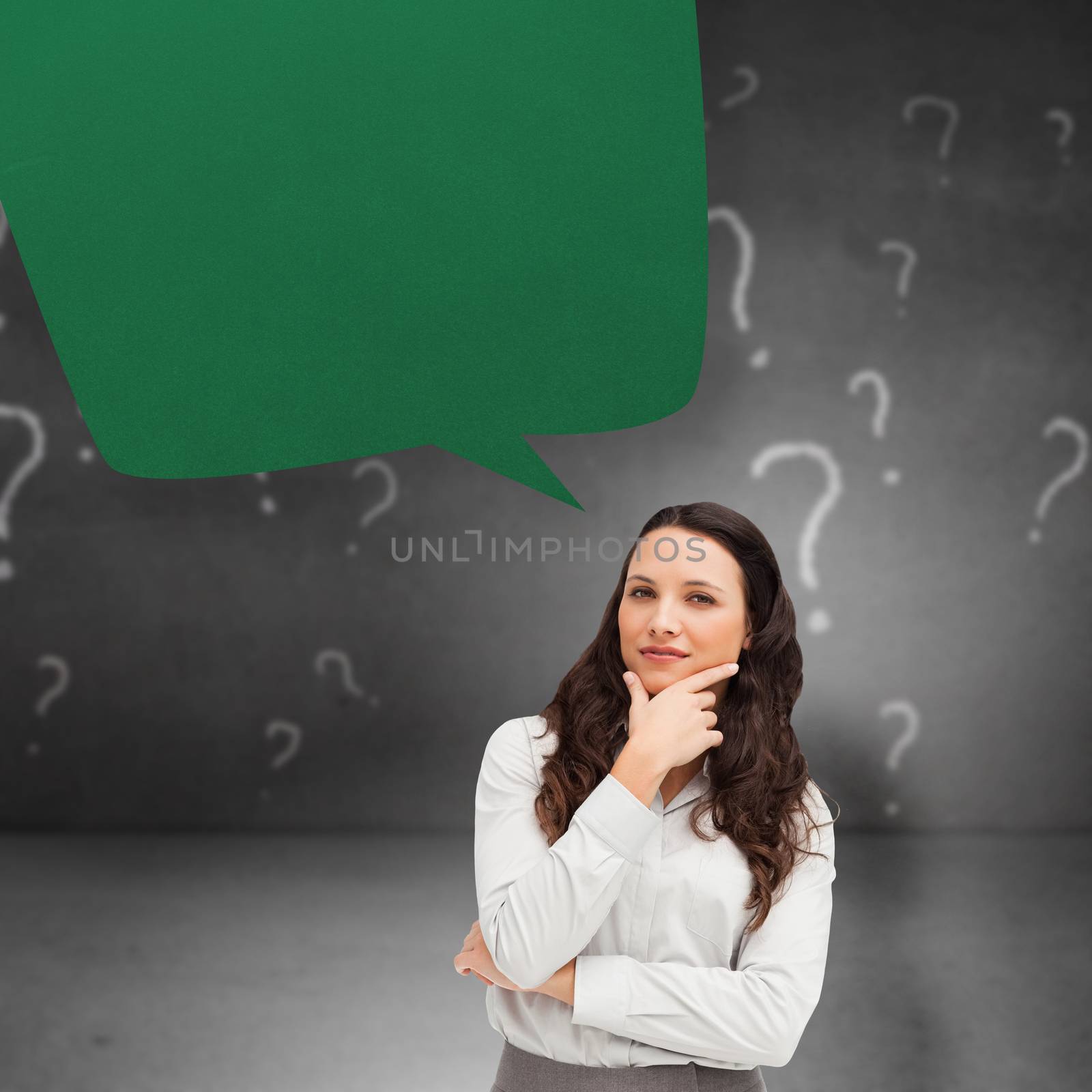 Portrait of a businesswoman posing against speech bubble