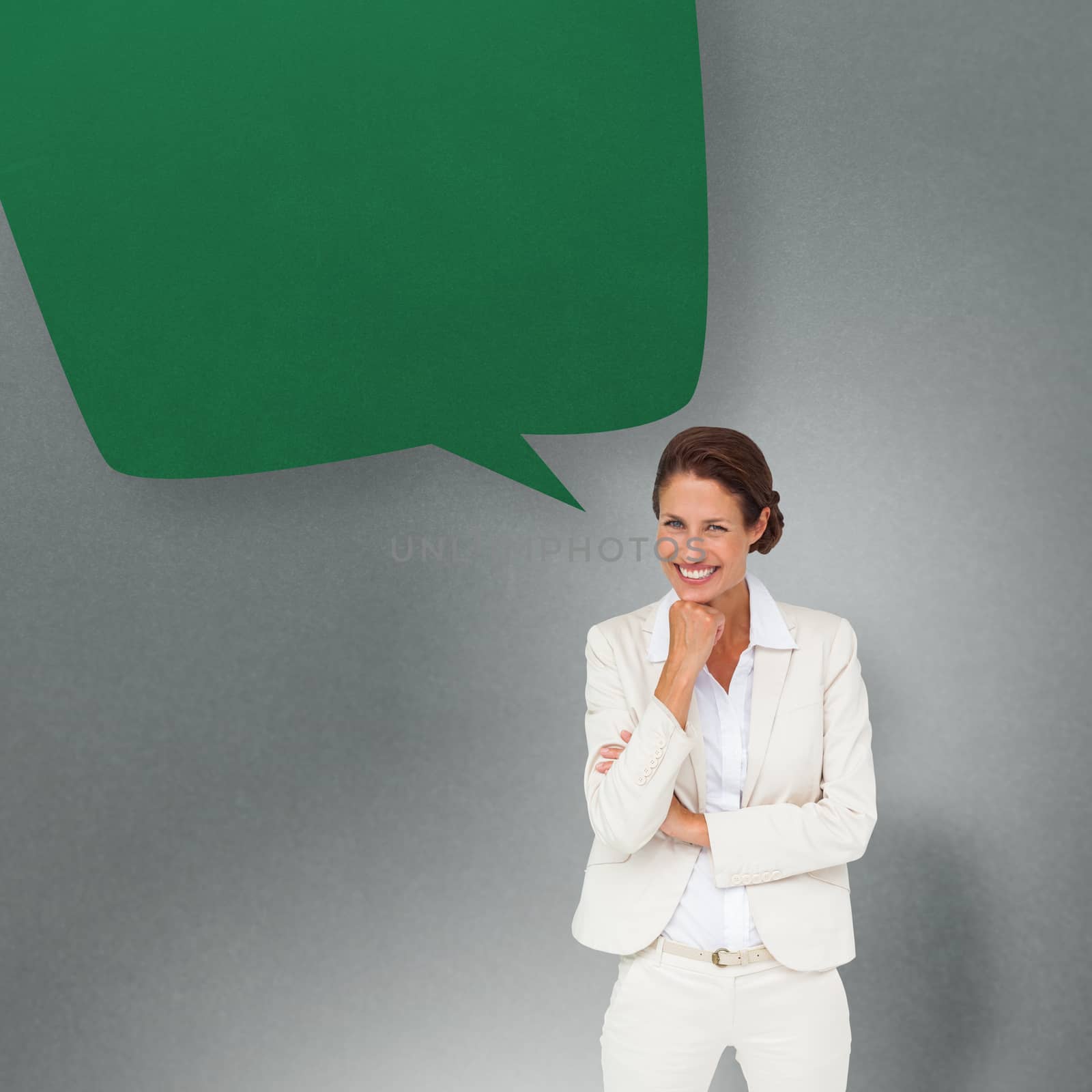 Thinking businesswoman with speech bubble against grey vignette
