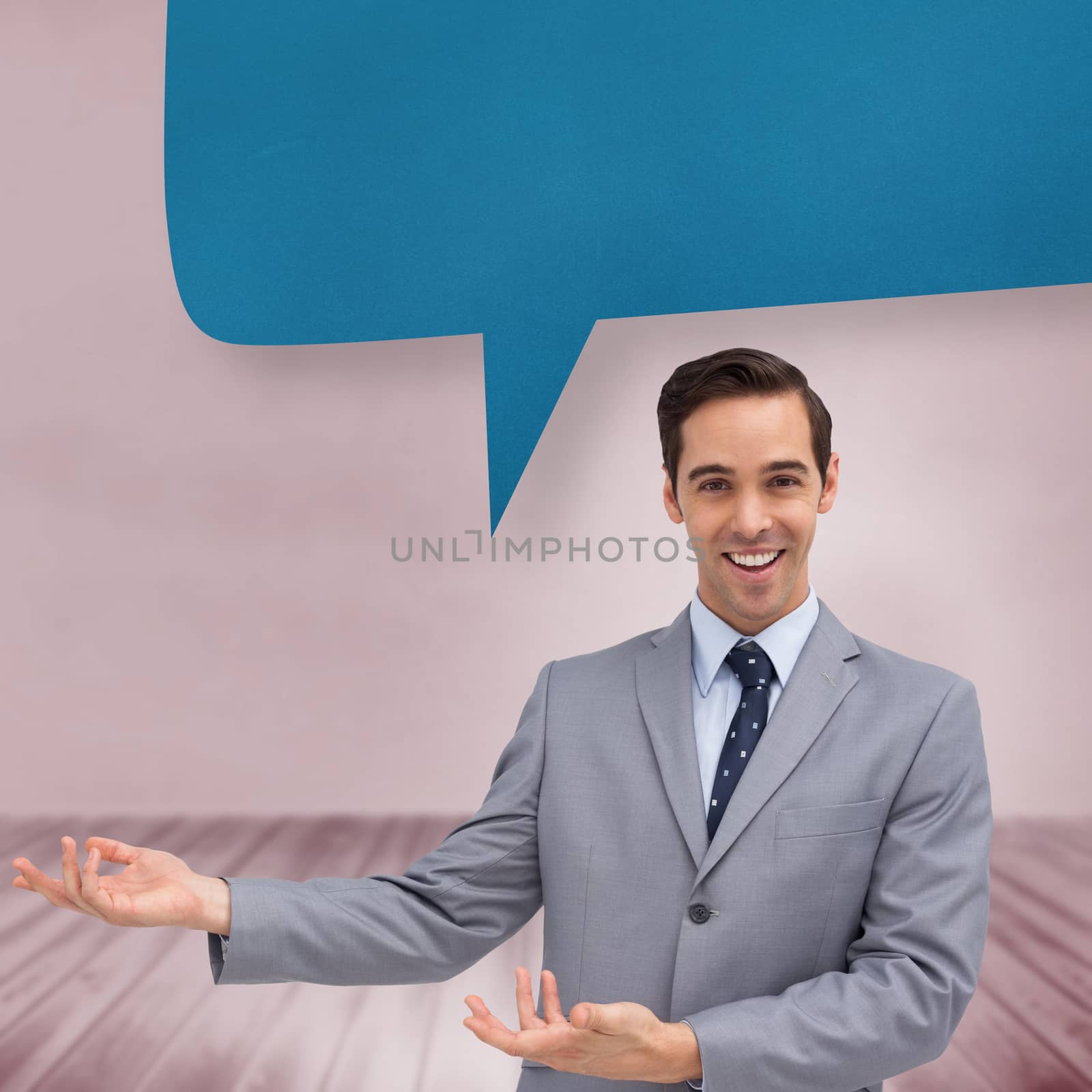 Young businessman presenting something  against speech bubble