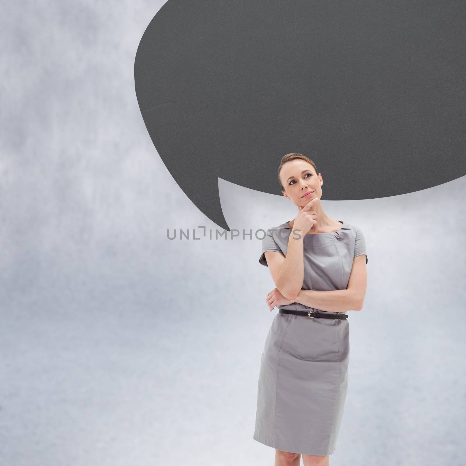 Thoughtful woman posing in dress with speech bubble by Wavebreakmedia