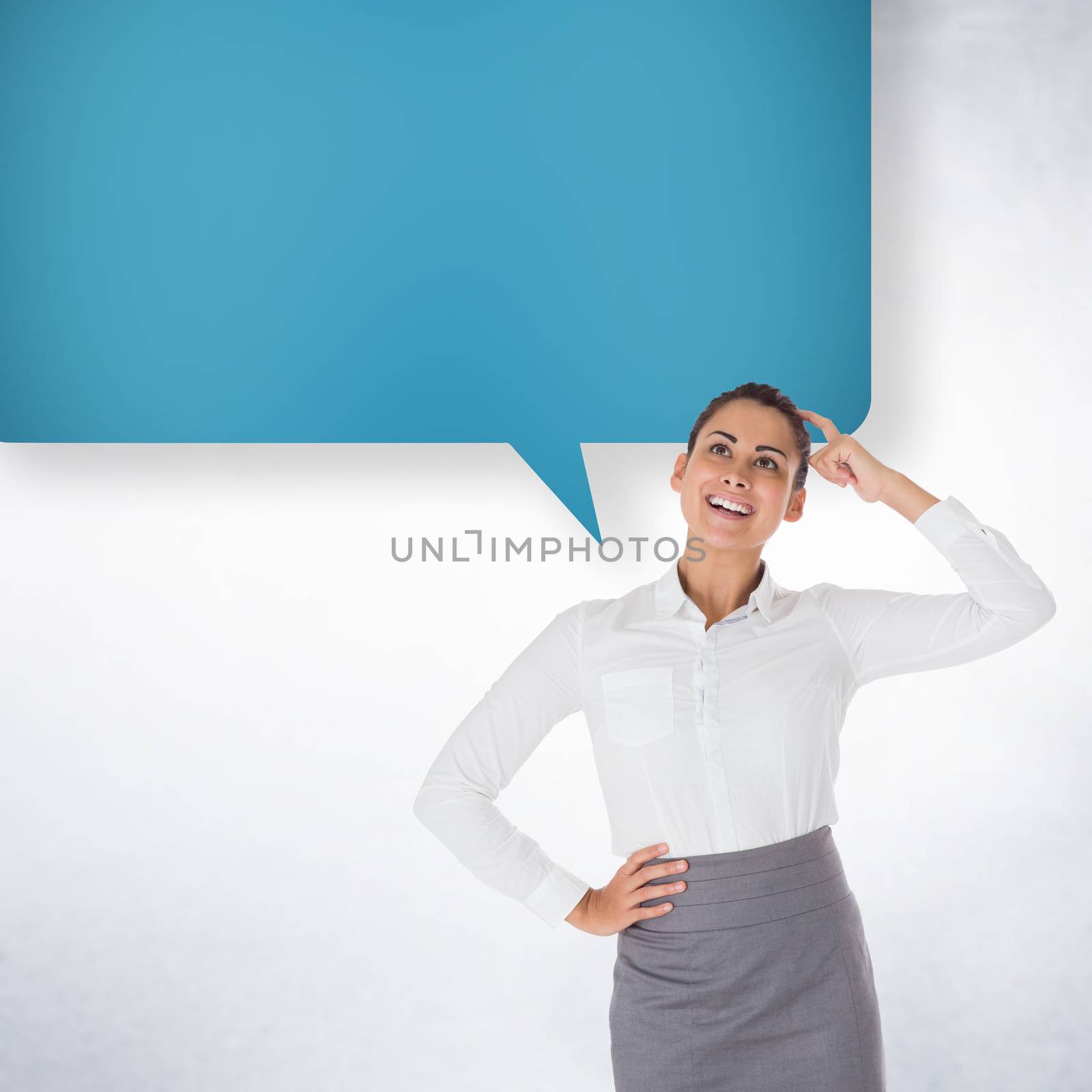 Smiling thoughtful businesswoman with speech bubble against white wall