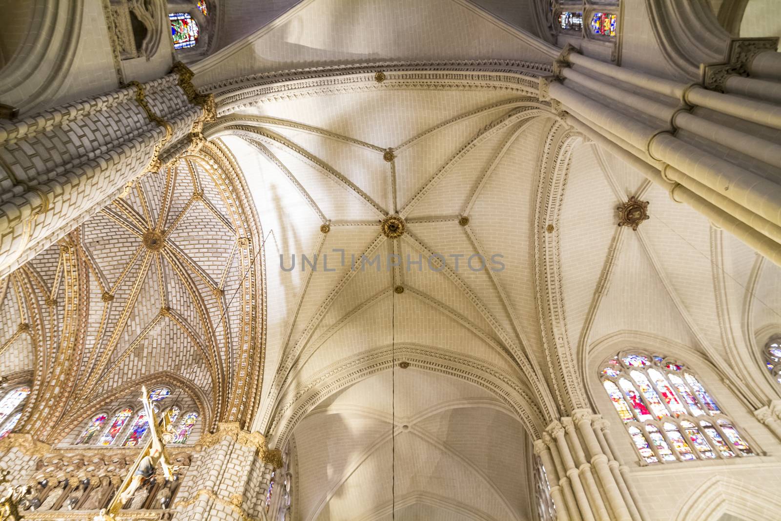 Interior of Toledo Cathedral. Arcs, organ, columns and gothic art. Spain