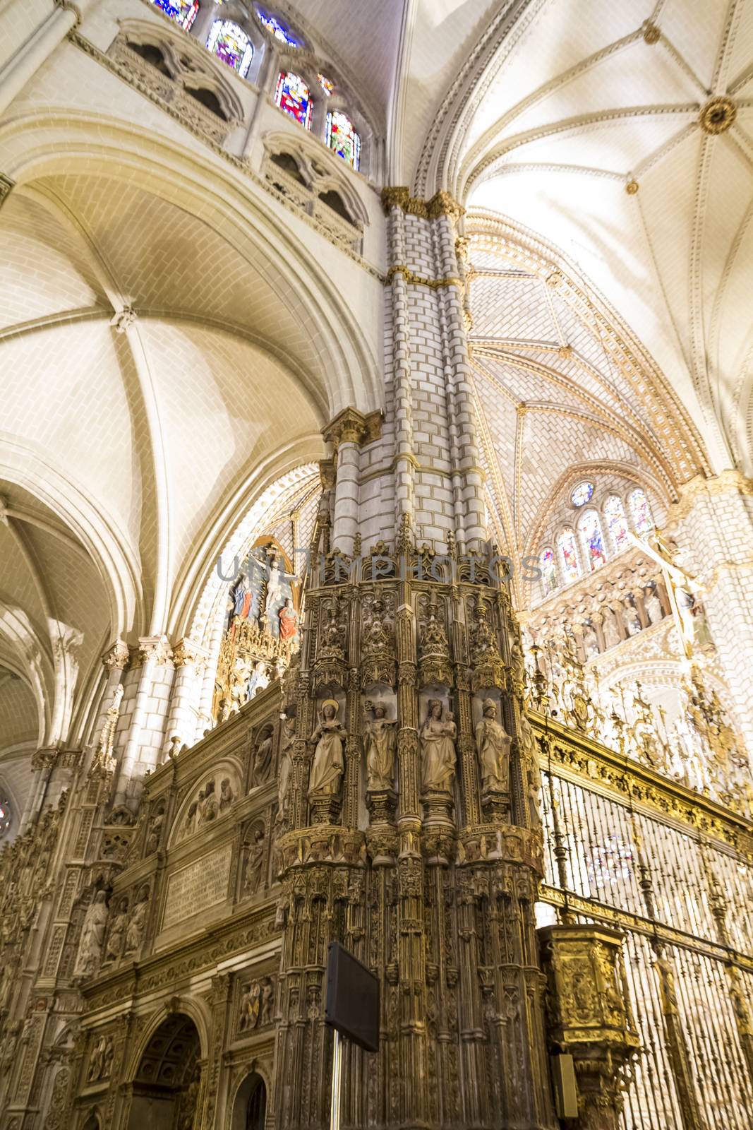 Interior of Toledo Cathedral. Arcs, organ, columns and gothic art. Spain