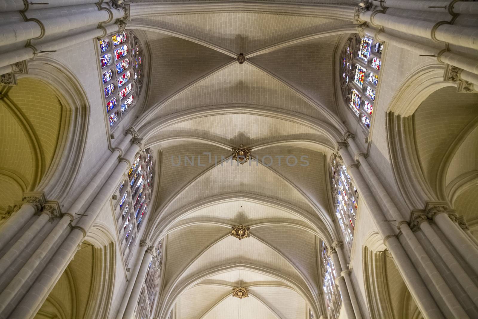 Interior of Toledo Cathedral. Arcs, organ, columns and gothic art. Spain