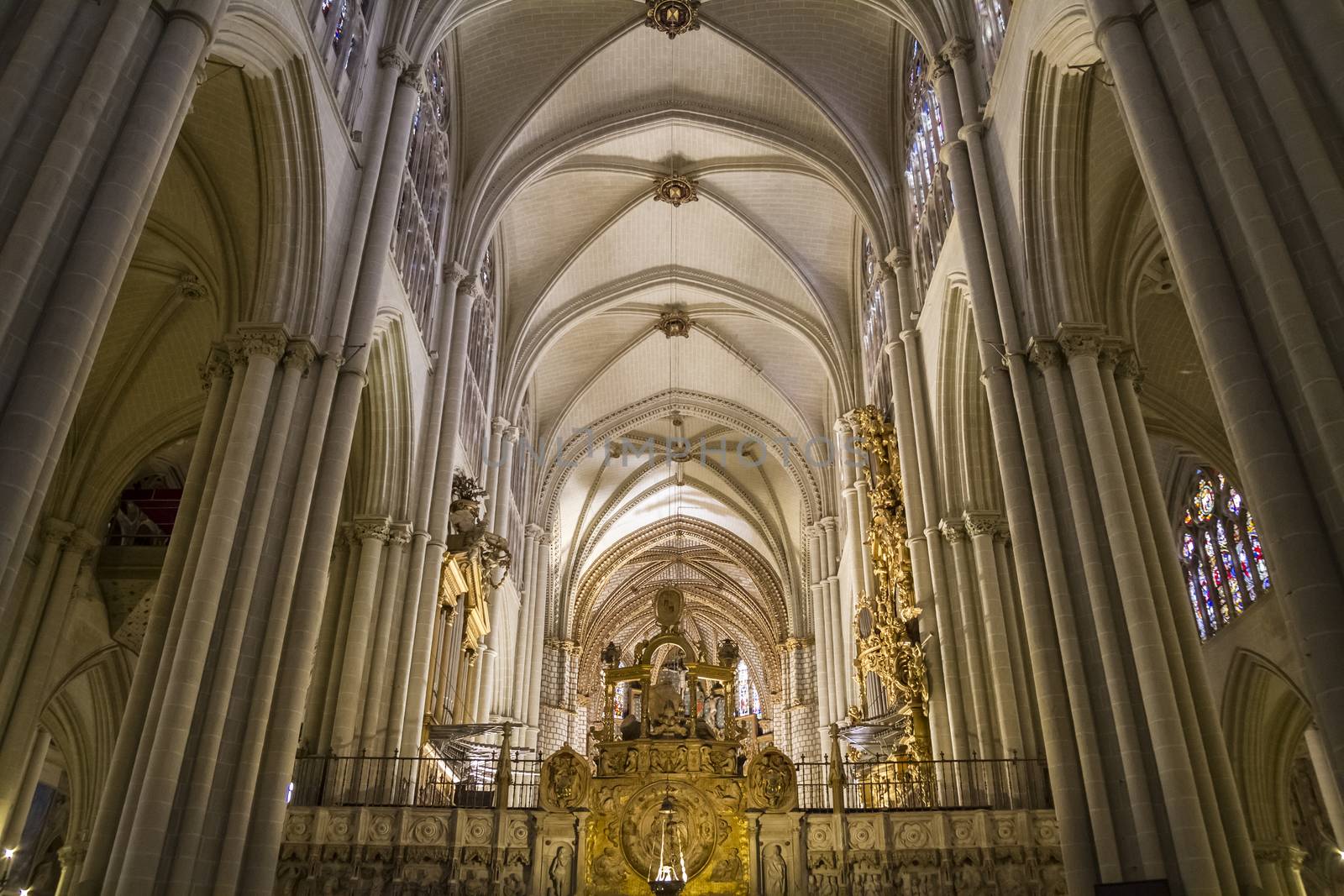 Interior of Toledo Cathedral. Arcs, organ, columns and gothic art. Spain