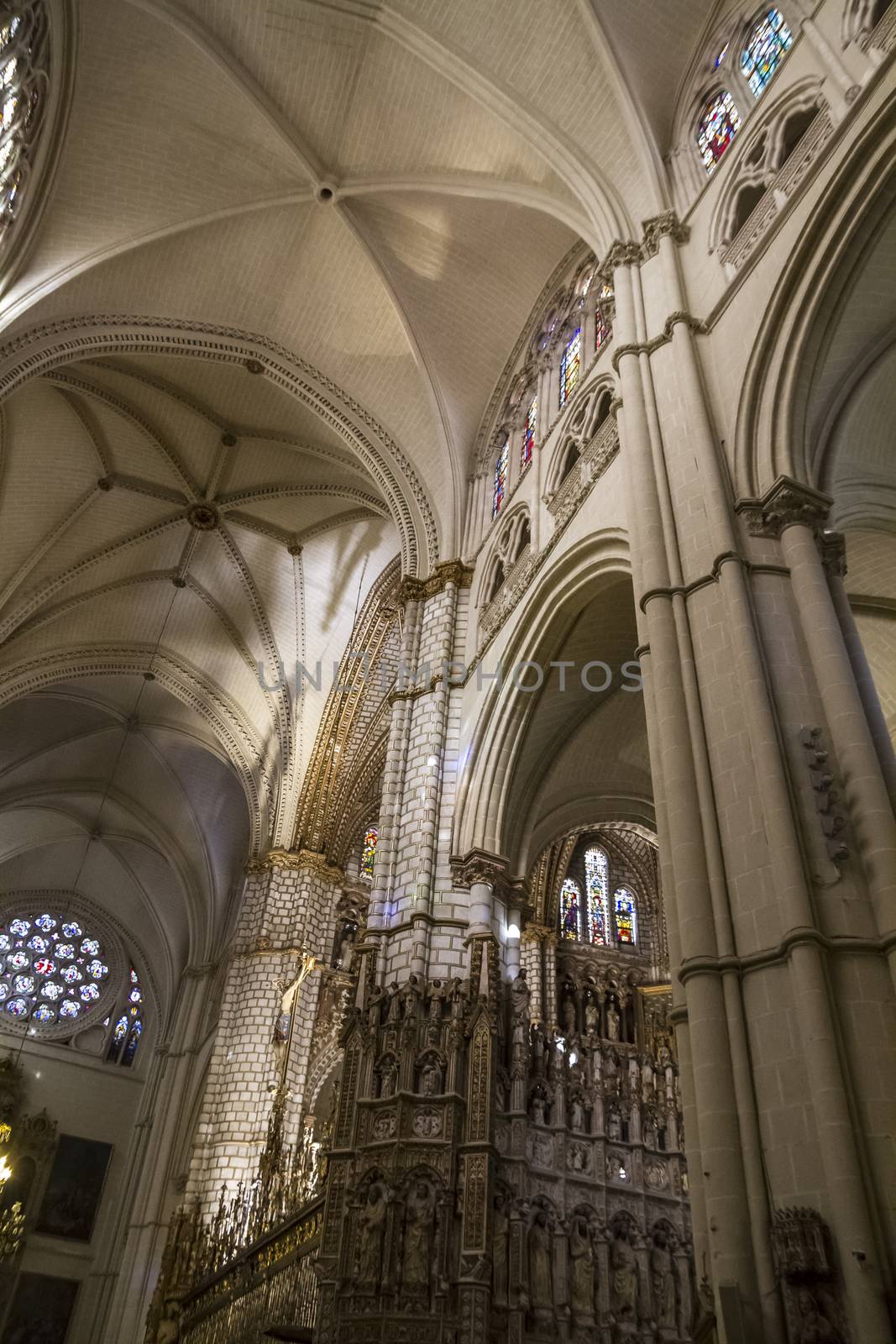 Interior of Toledo Cathedral. Arcs, organ, columns and gothic art. Spain