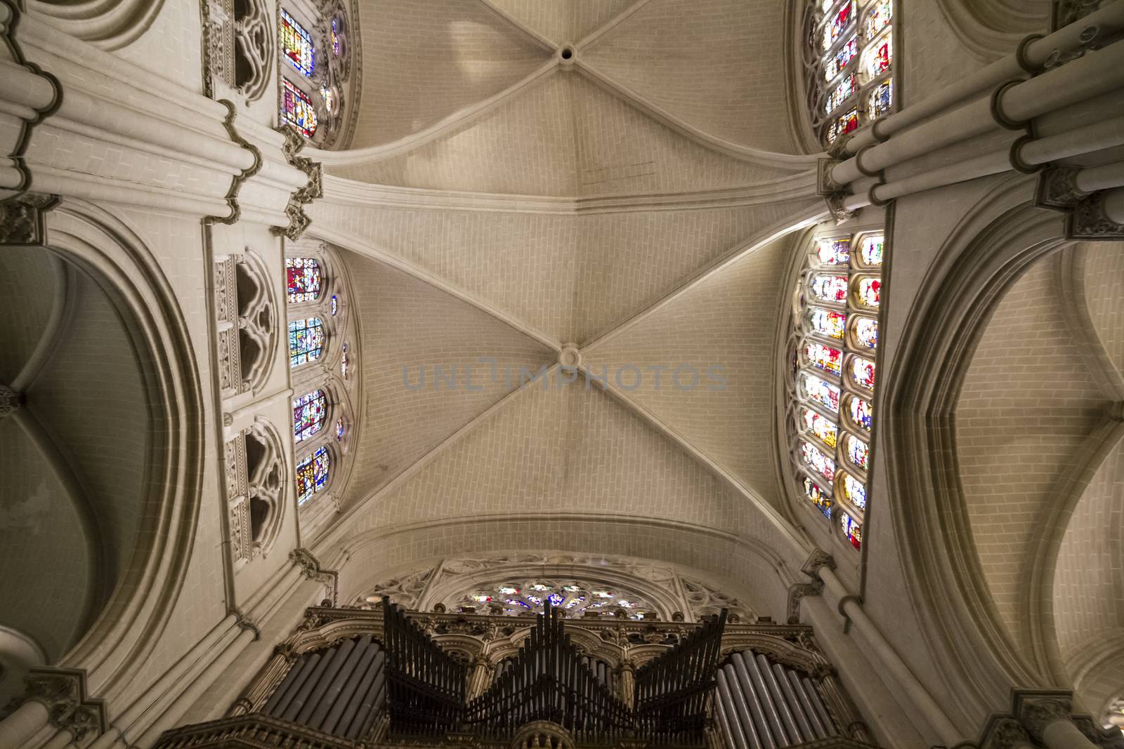 Interior of Toledo Cathedral. Arcs, organ, columns and gothic art. Spain