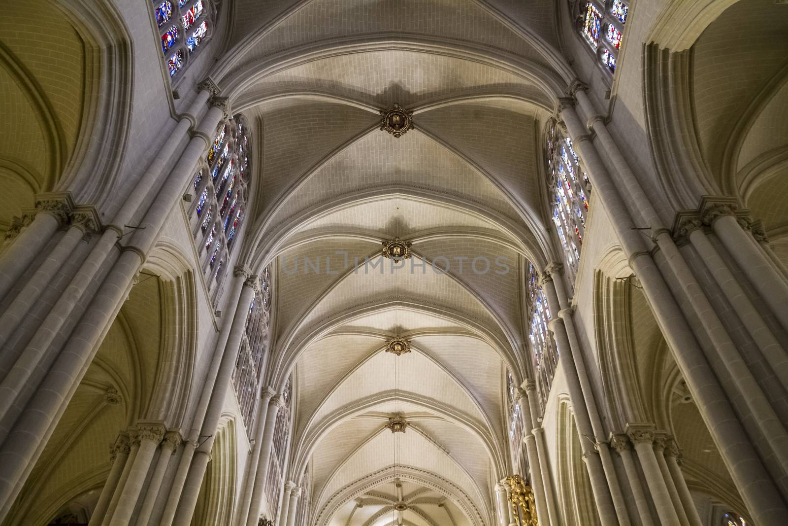 Interior of Toledo Cathedral. Arcs, organ, columns and gothic art. Spain