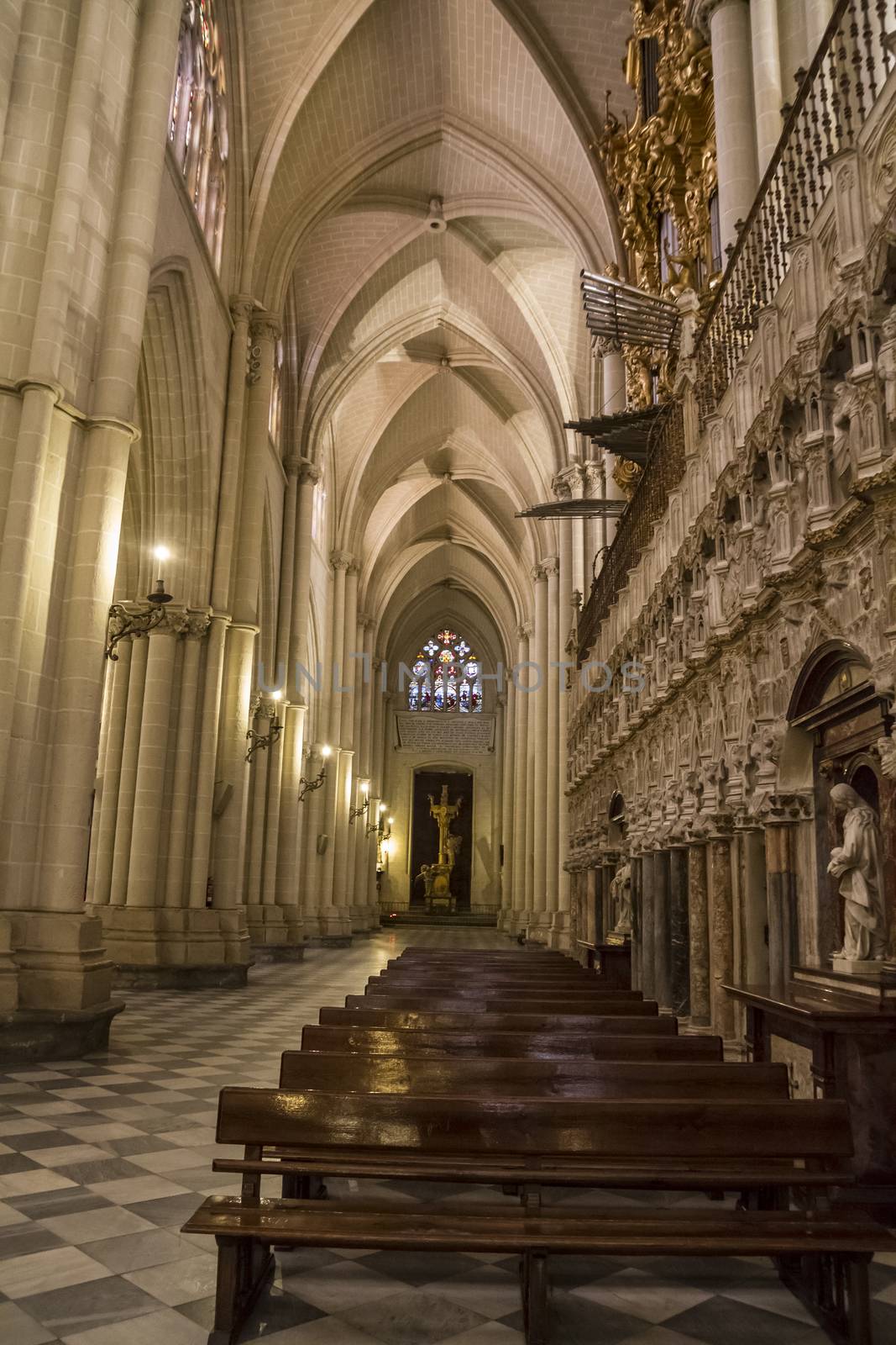 Interior of Toledo Cathedral. Arcs, organ, columns and gothic art. Spain