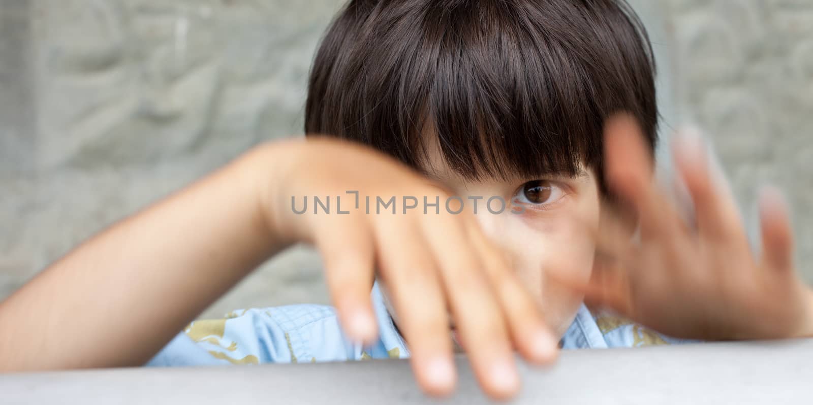 little boy in expression, close-up by Astroid