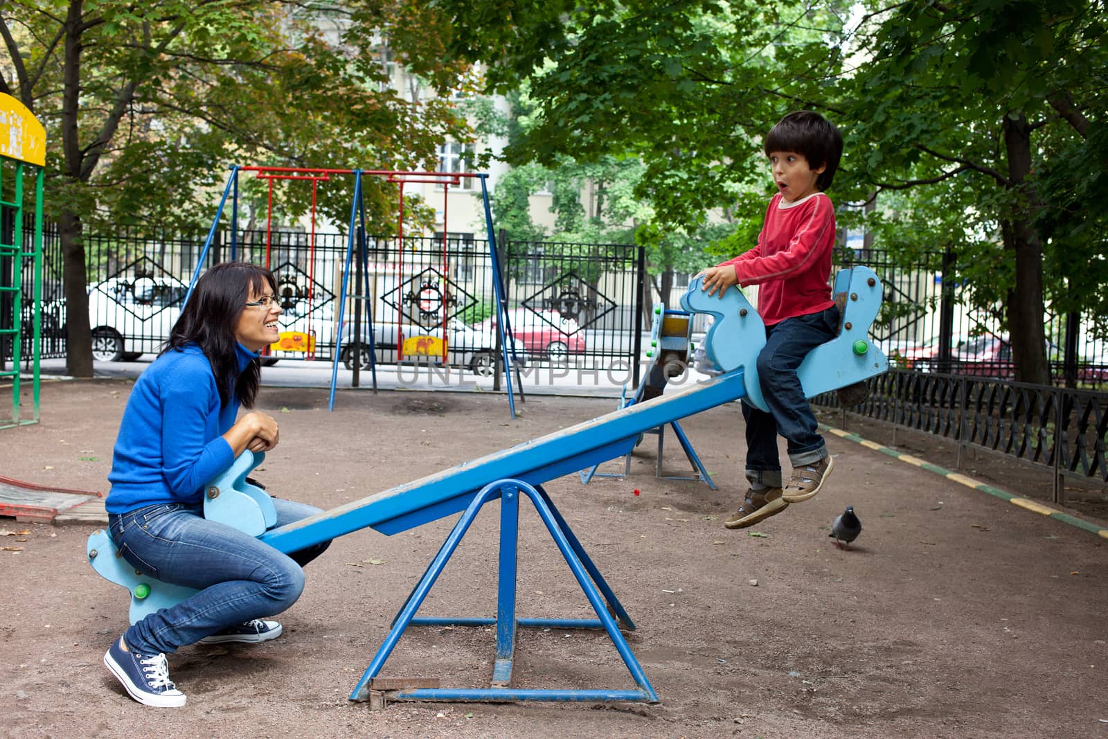 Mother and son on a swing