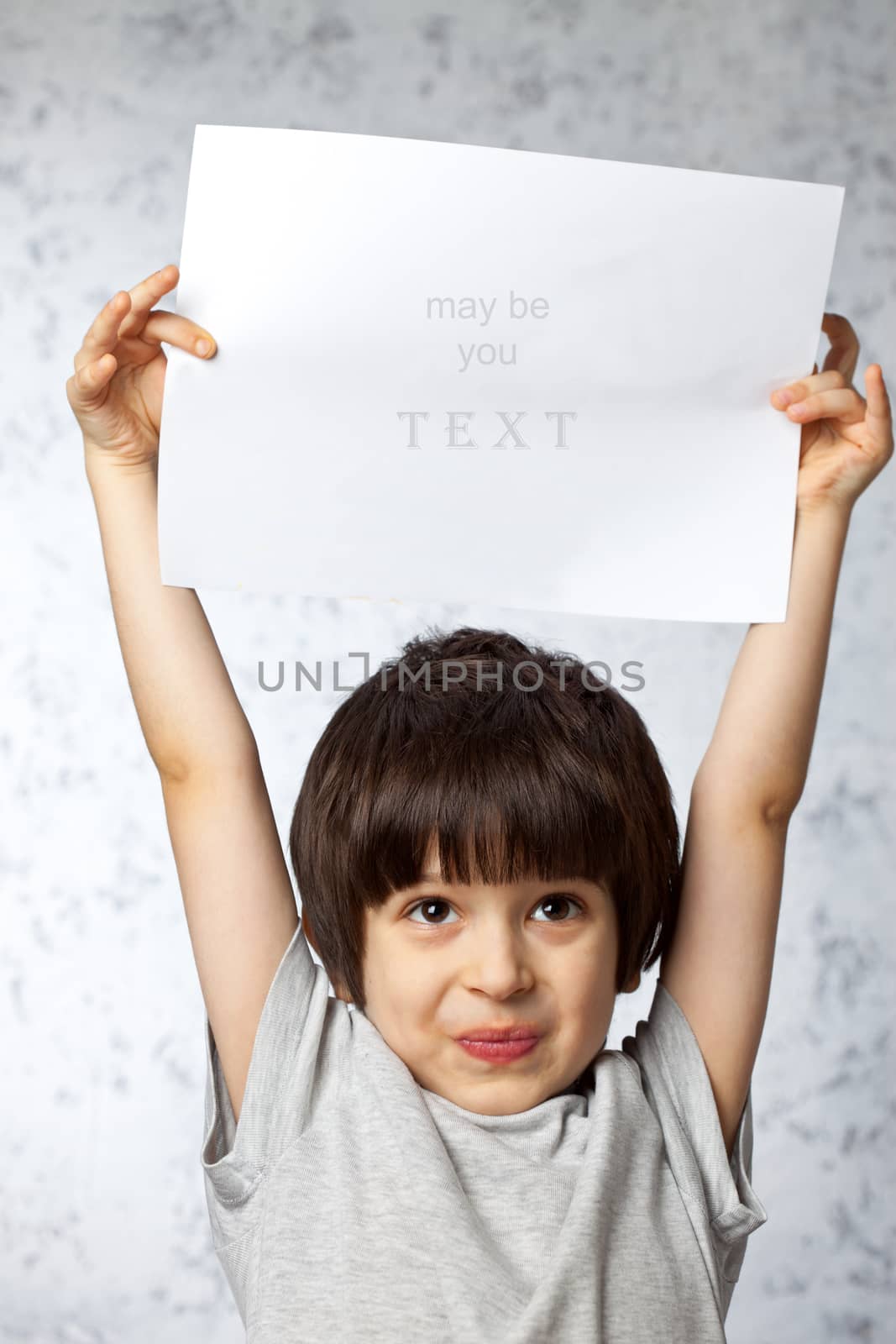 enthusiastic boy overhead showing  displaying placard ready for your text or product