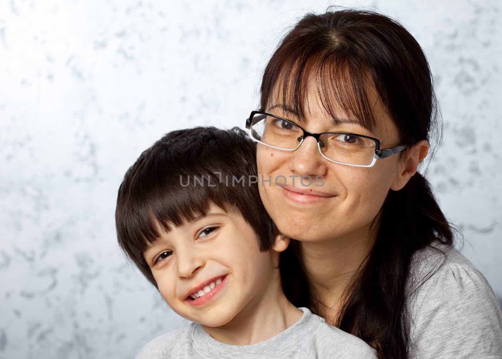 Smiling happy mother and son