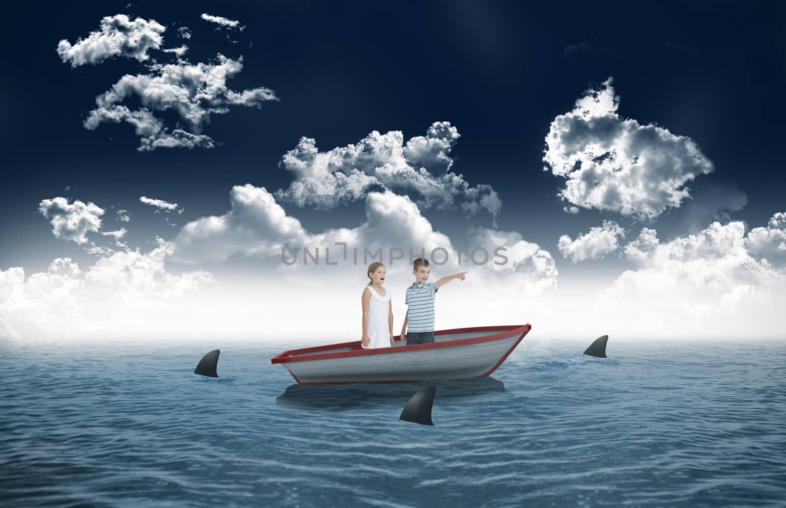 Young boy showing something to his sister against sharks circling small boat in the sea