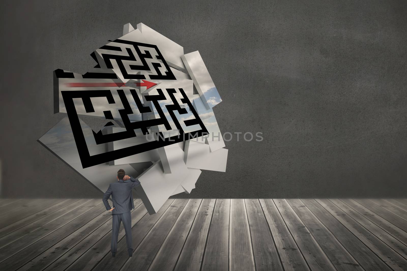 Thinking businessman against maze graphic on abstract screen in room