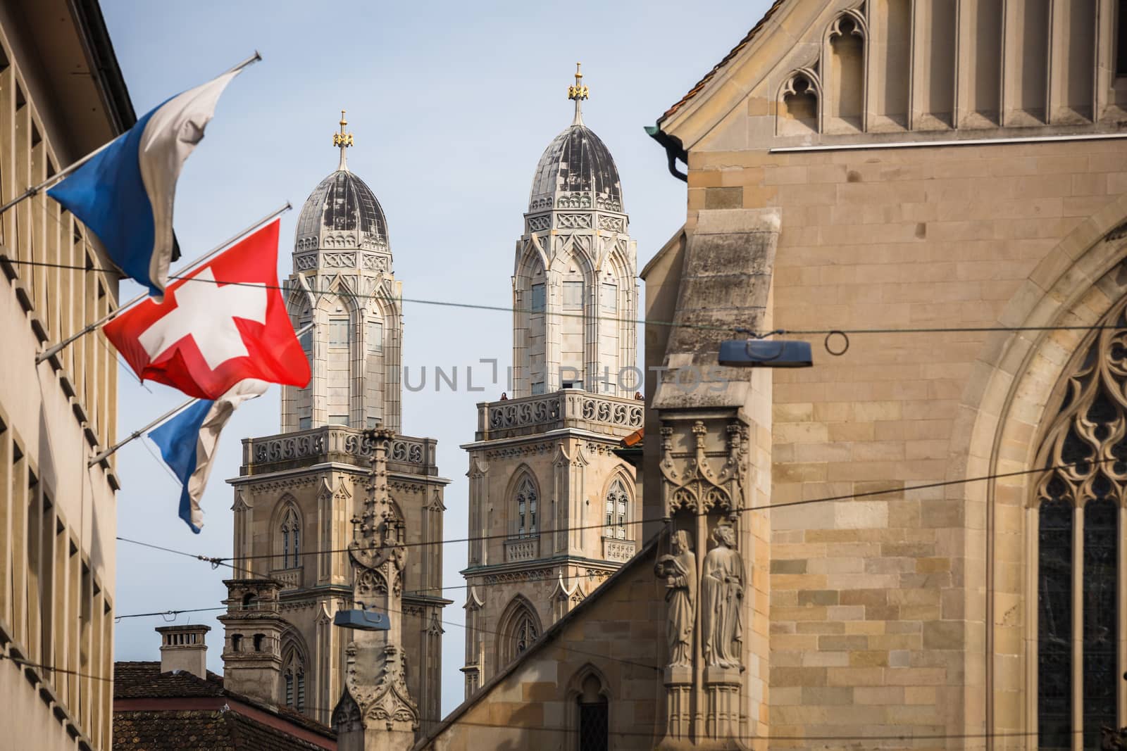 Zurich, Switzerland - The Grossmunster towers behind Fraumünster church, shot from Paradeplatz