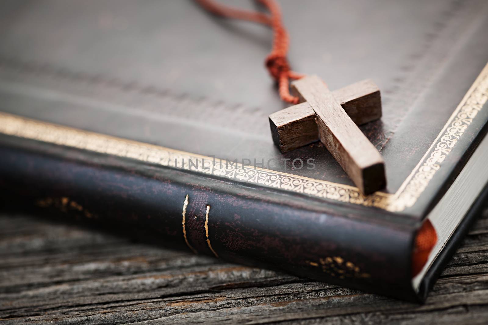 Cross on Bible by elenathewise