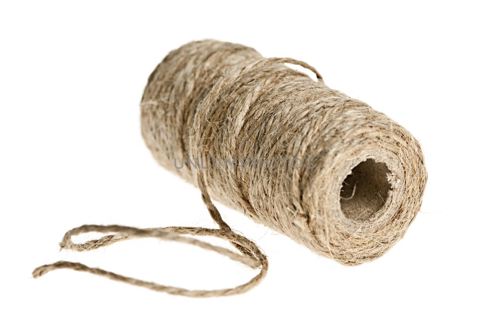 Spool of brown rough twine isolated on white background