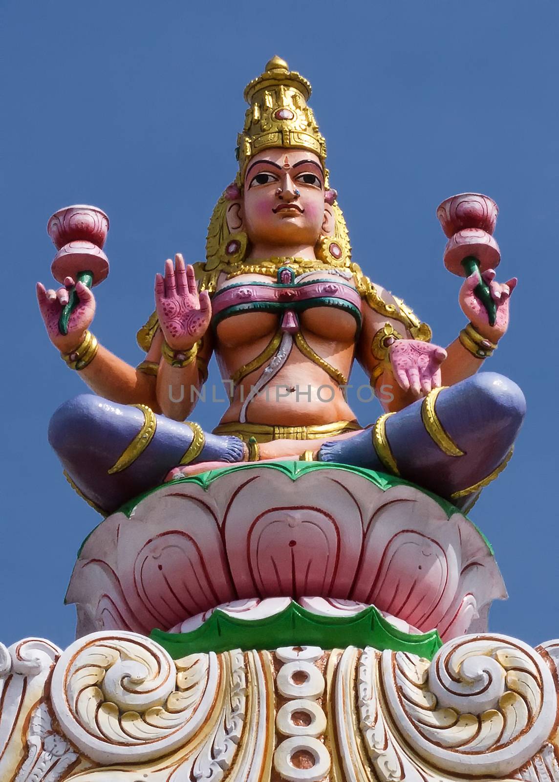 Goddess Lakshmi on top of the entrance gate at Sripuram, the Golden Temple, in Vellore, Tamil Nadu, India.