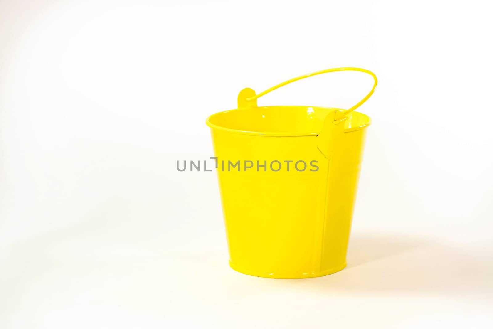 bright yellow bucket by nattapatt