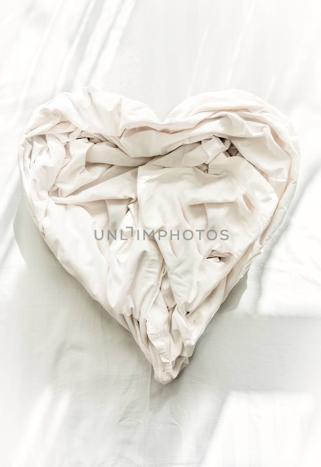 Photo of bed sheet in shape of heart