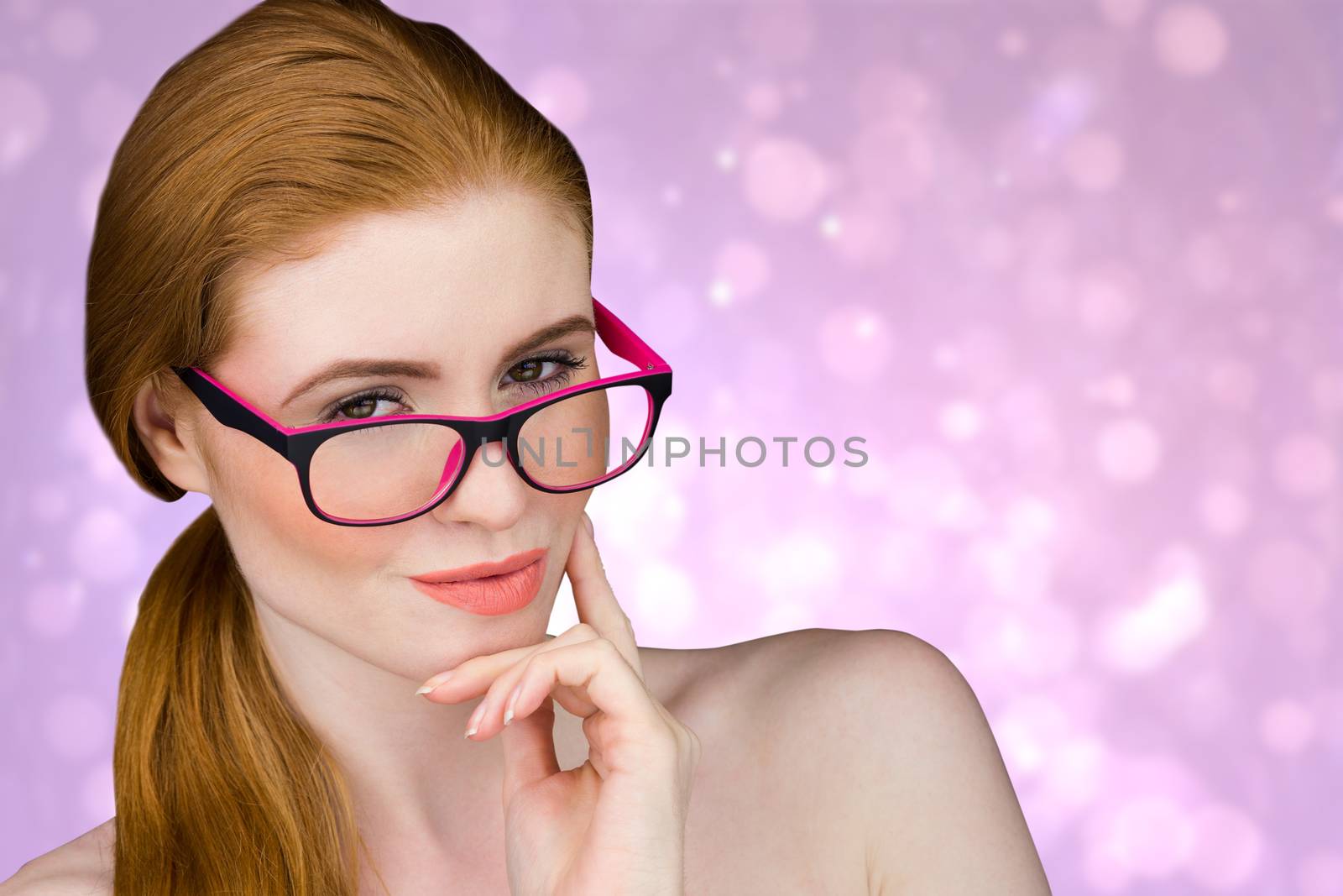 Beautiful redhead posing with glasses against purple abstract light spot design