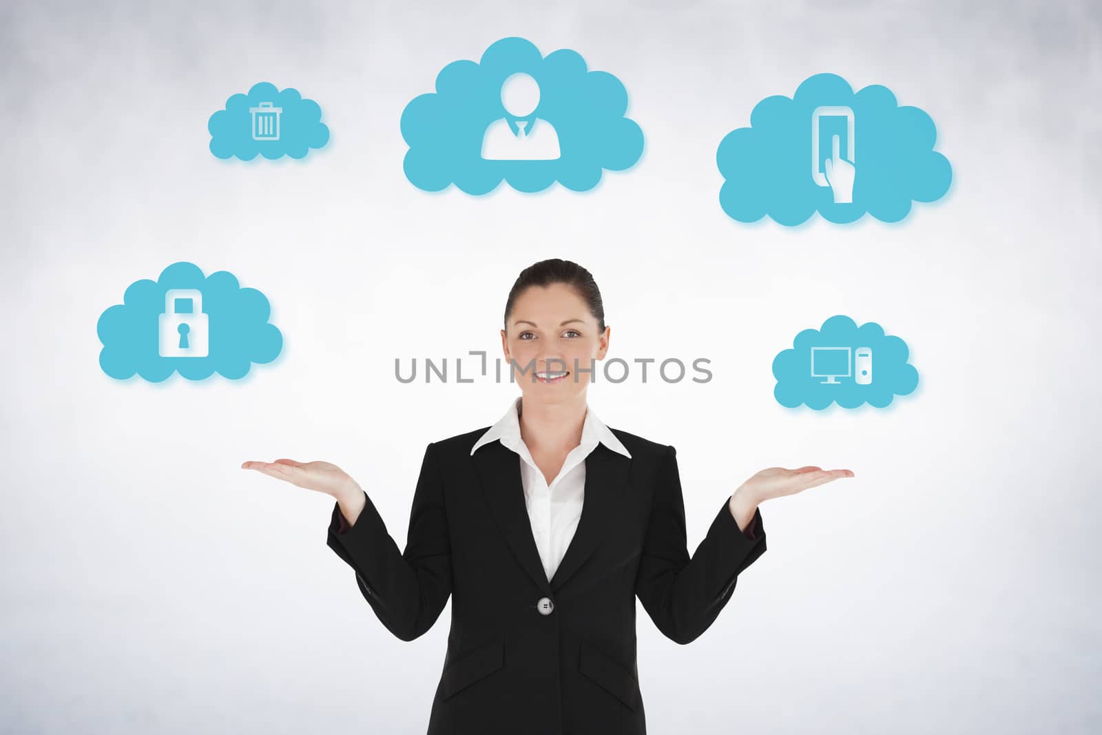 Composite image of charming woman in suit showing graphics against white wall
