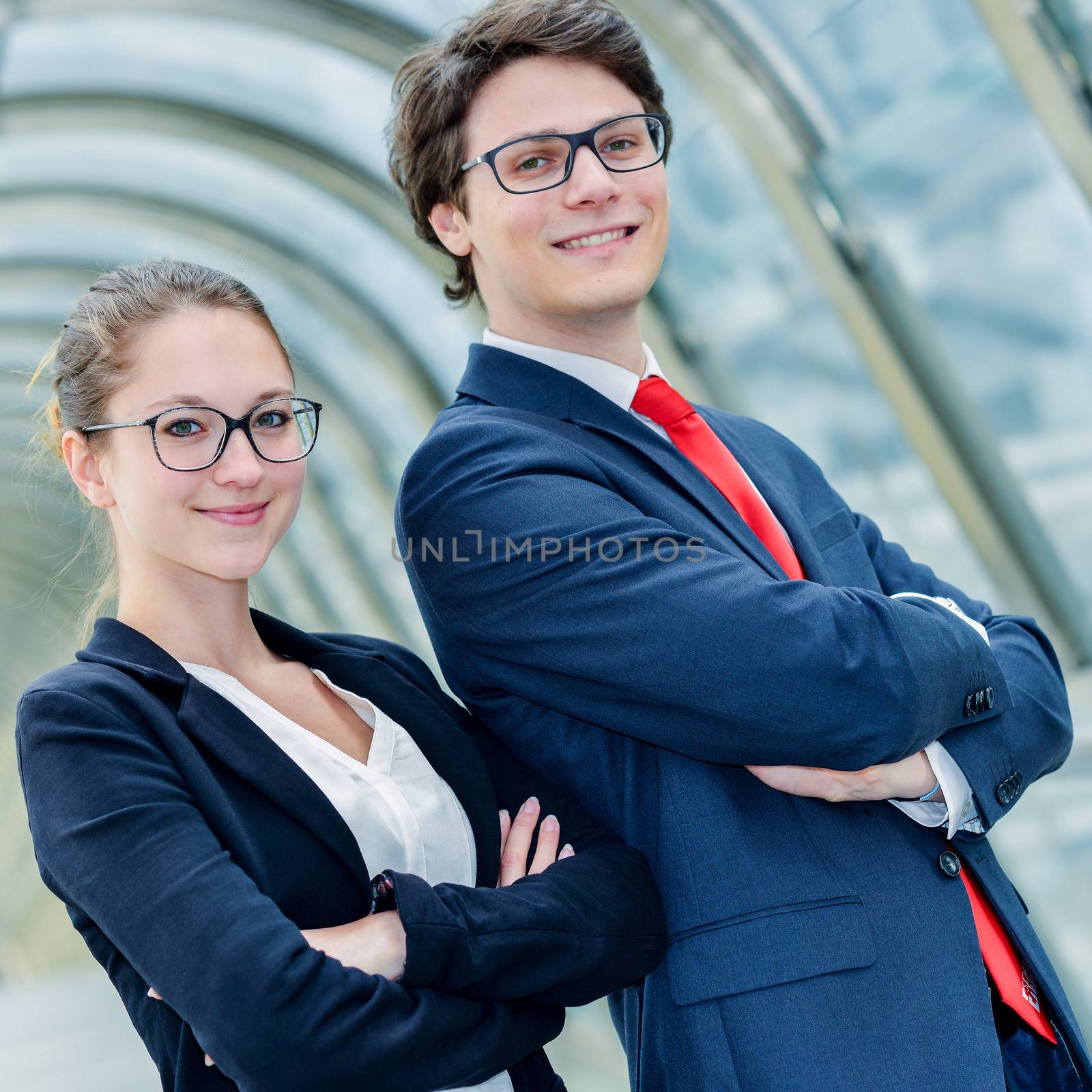 expressive portrait Junior executives of company crossed arms