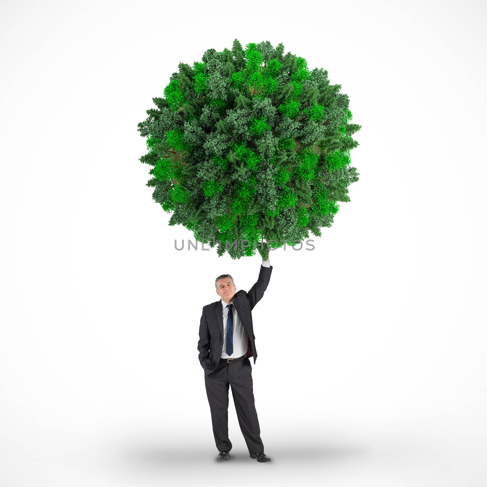 Composite image of businessman holding green sphere against white background with vignette