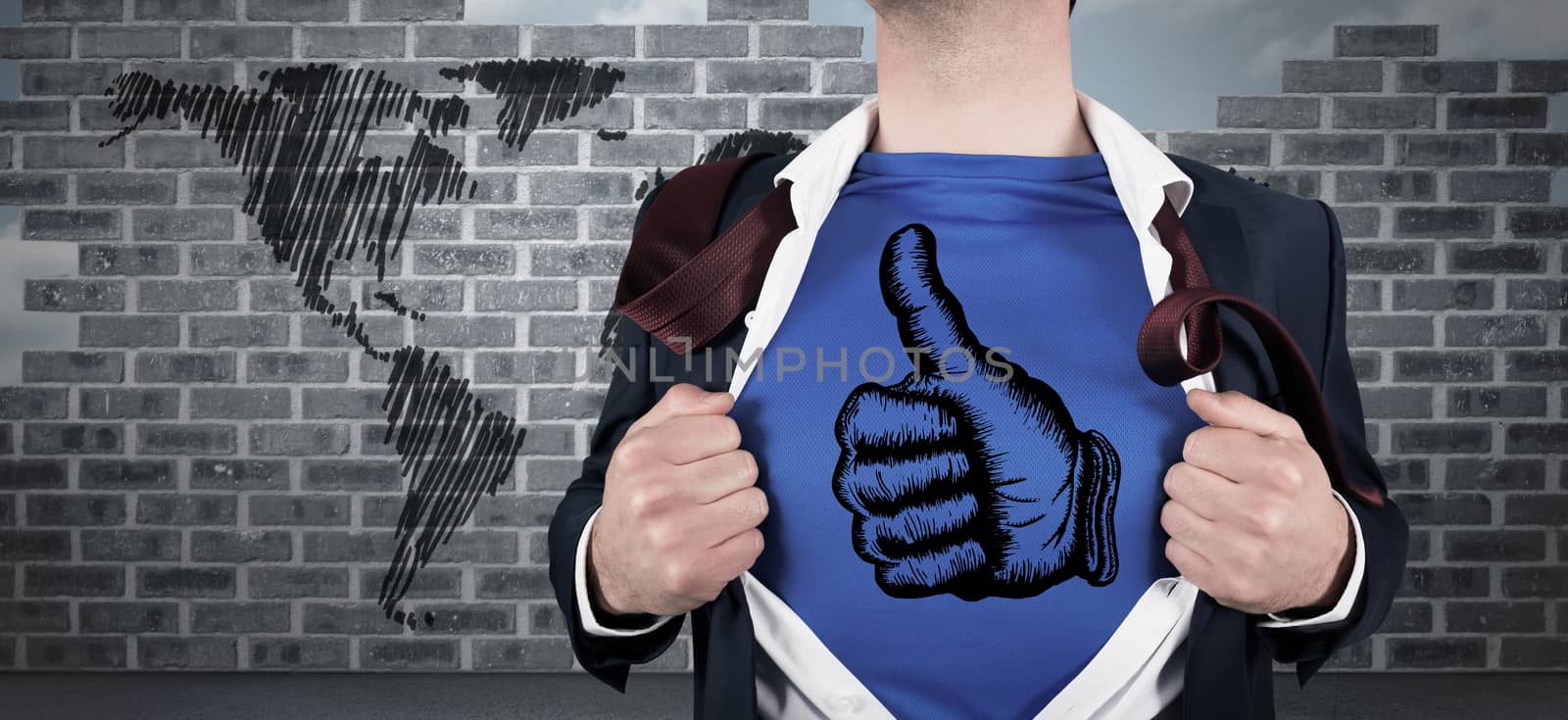 Businessman opening his shirt superhero style against world map doodle against wall