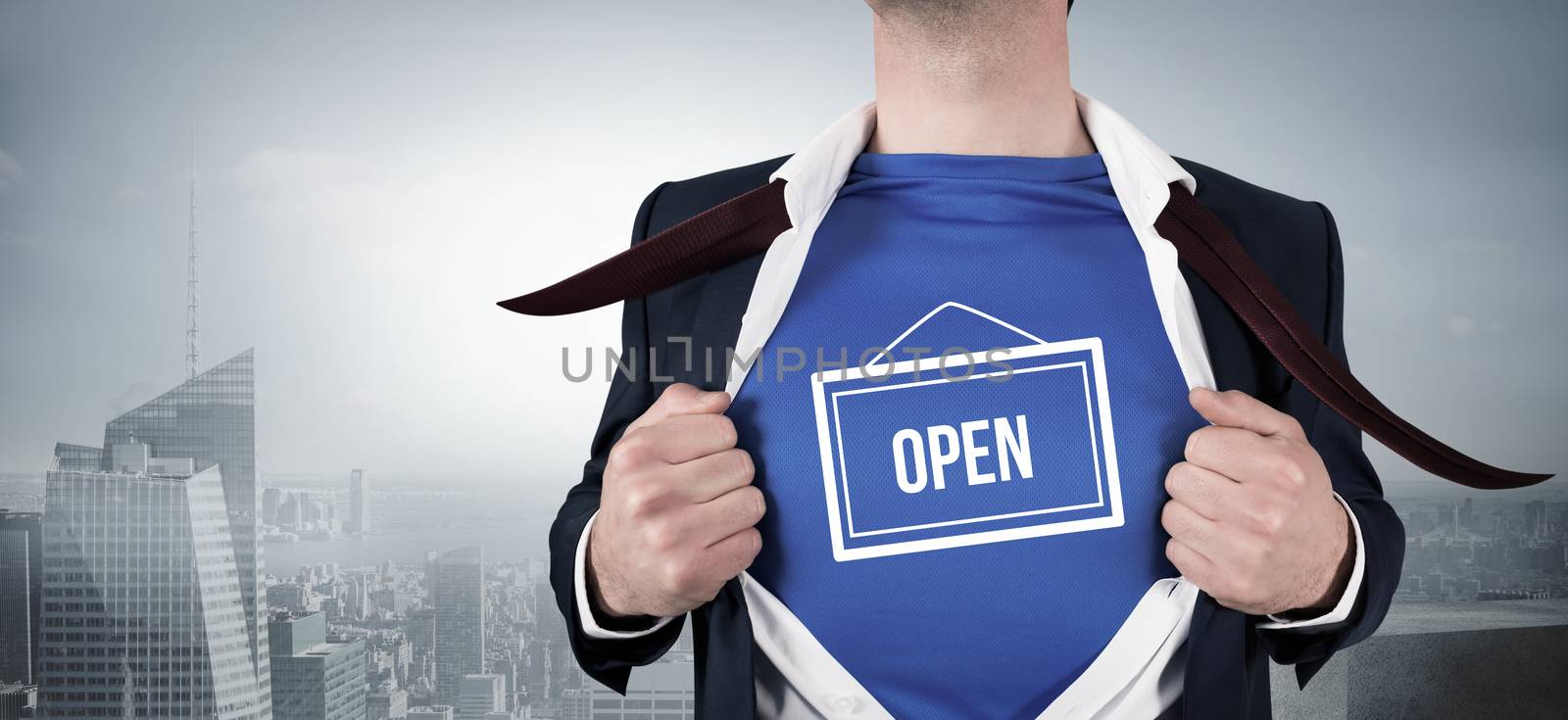 Composite image of businessman opening his shirt superhero style by Wavebreakmedia