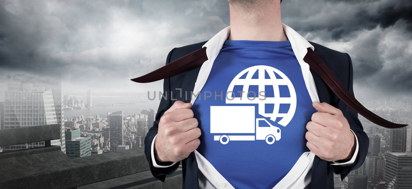 Composite image of businessman opening his shirt superhero style by Wavebreakmedia