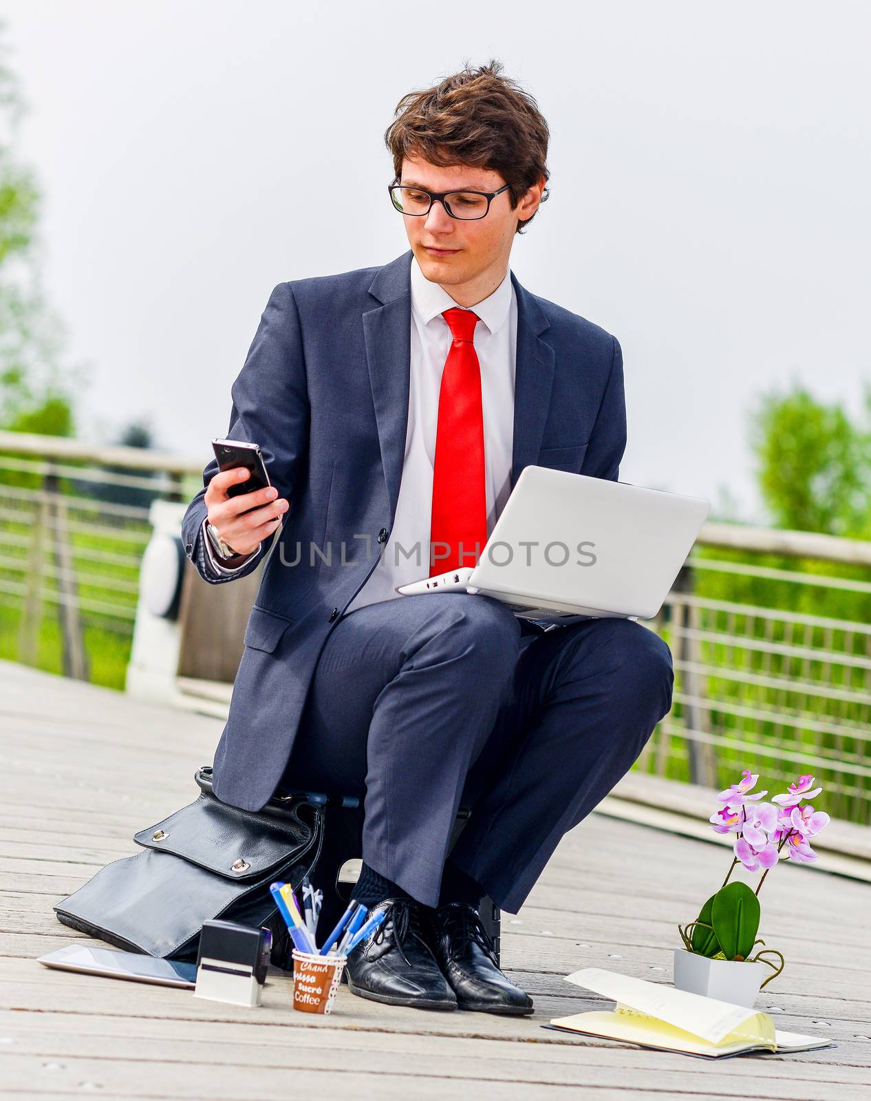 Junior executive dynamic working outside of his office