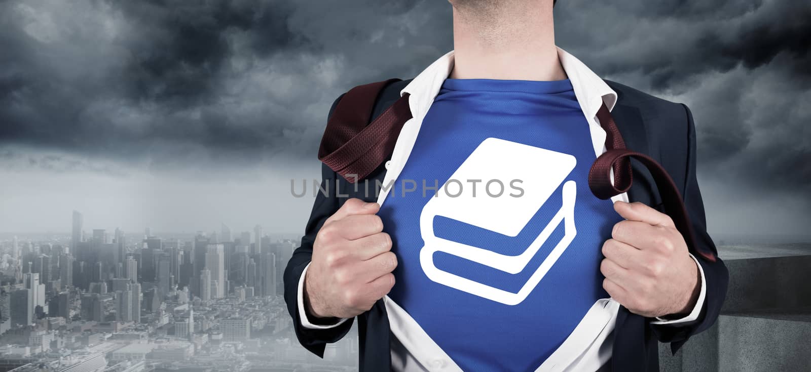 Businessman opening his shirt superhero style against coastline and city