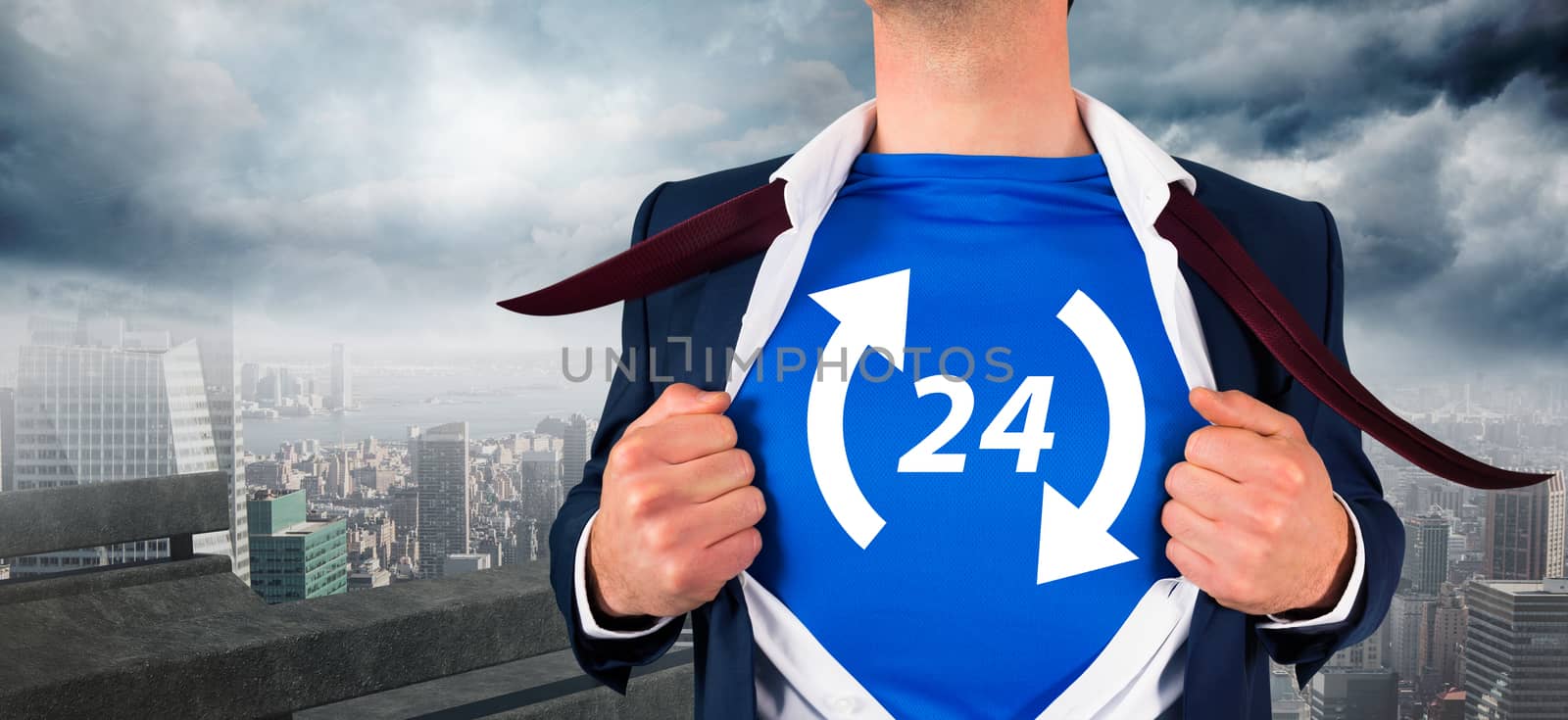 Businessman opening his shirt superhero style against balcony overlooking city