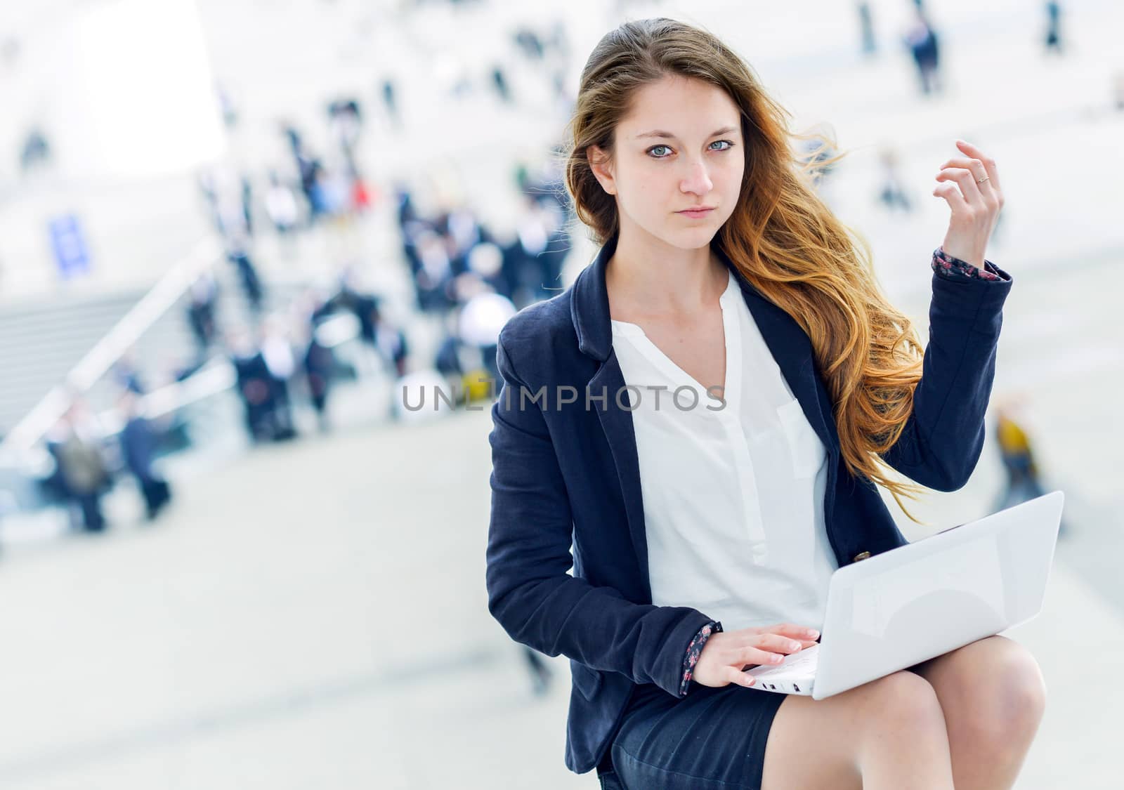 Junior executive dynamic working outside of her office