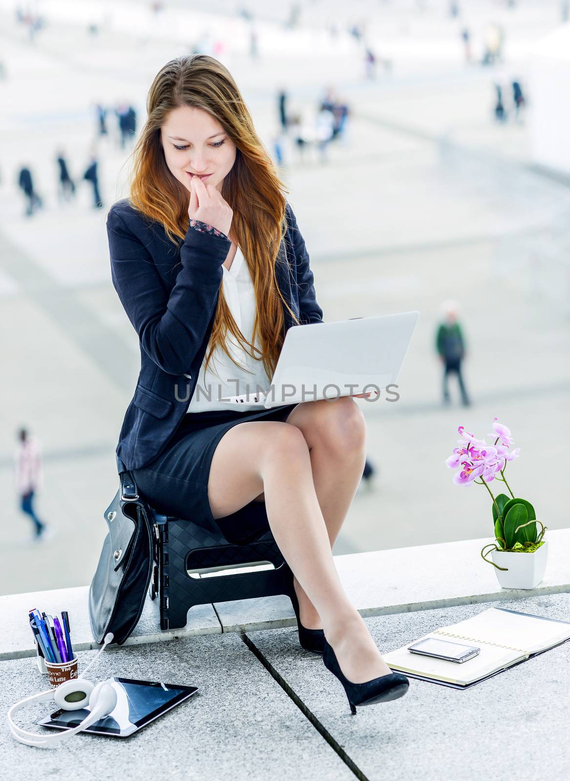 Stressed junior executive dynamic working outside of her office